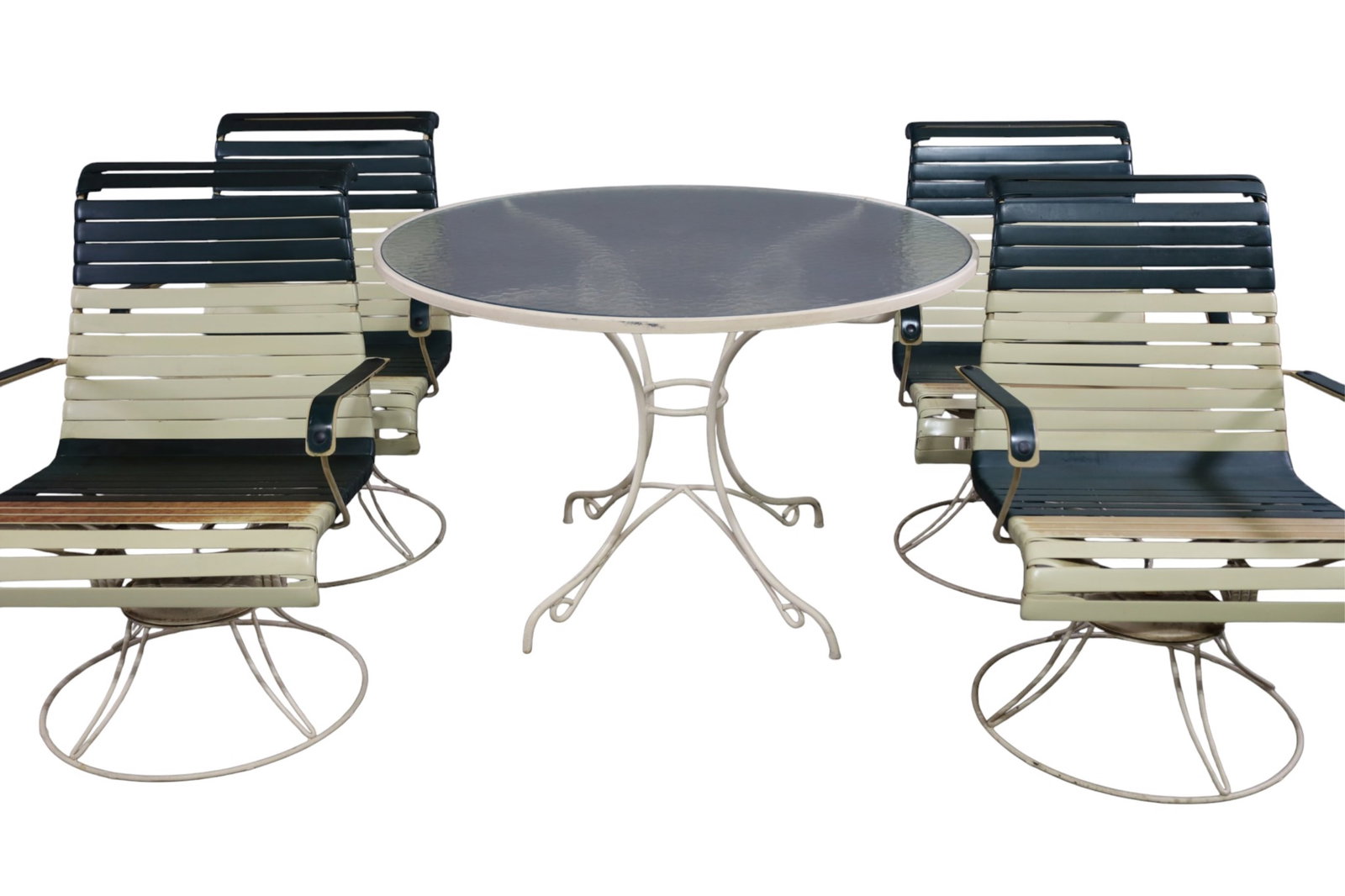 VINTAGE PATIO SET: FOUR ARMCHAIR ROCKERS & GLASS TOP TABLE, DISOLORATION TO SEATS, SOME RUST. 24" W x 22" D x 33" H. CHAIRS, & 43" DIAM x 27" H. THIS ITEM EXCEEDS SIZE LIMITATIONS FOR IN HOUSE SHIPPING, MUST BE PICKED
