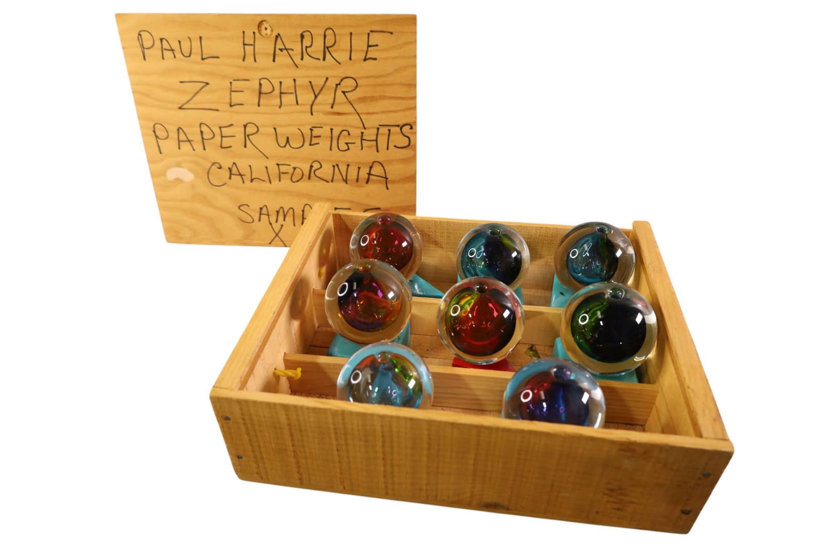 PAUL HARRIE ZEPHYR PAPERWEIGHT SAMPLES: CASE OF 8 PAUL HARRIE ZEPHYR PAPERWEIGHT SAMPLES. 5" H.