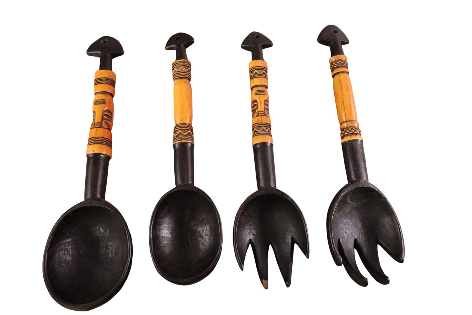 CARVED AFRICAN UTENSILS: 4 CARVED WOODEN AFRICAN UTENSILS. 16 1/2" L.