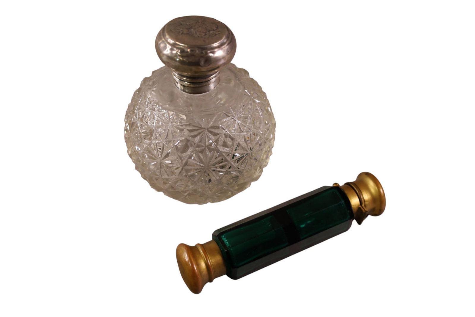 2 VICTORIAN PERFUME BOTTLES: CUT GLASS STERLING TOPPED BOTTLE, NO STOPPER. & GREEN GLASS DOUBLE PERFUME. 5" L. & 4 1/2" H.