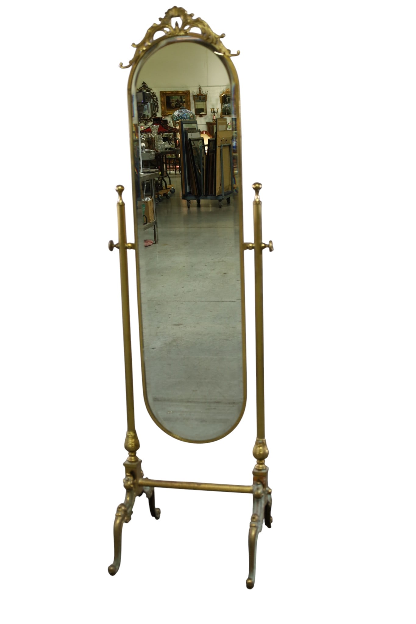 ORNATE BRASS CHEVAL MIRROR: ORNATE BRASS CHEVAL MIRROR, SOME PITTING TO SURFACE. 19 1/2" W x 64" H. THIS ITEM EXCEEDS SIZE LIMITATIONS FOR IN HOUSE SHIPPING, MUST BE SHIPPED VIA 3rd PARTY GROUND SHIPPER OR PICKED UP IN HOUSE.