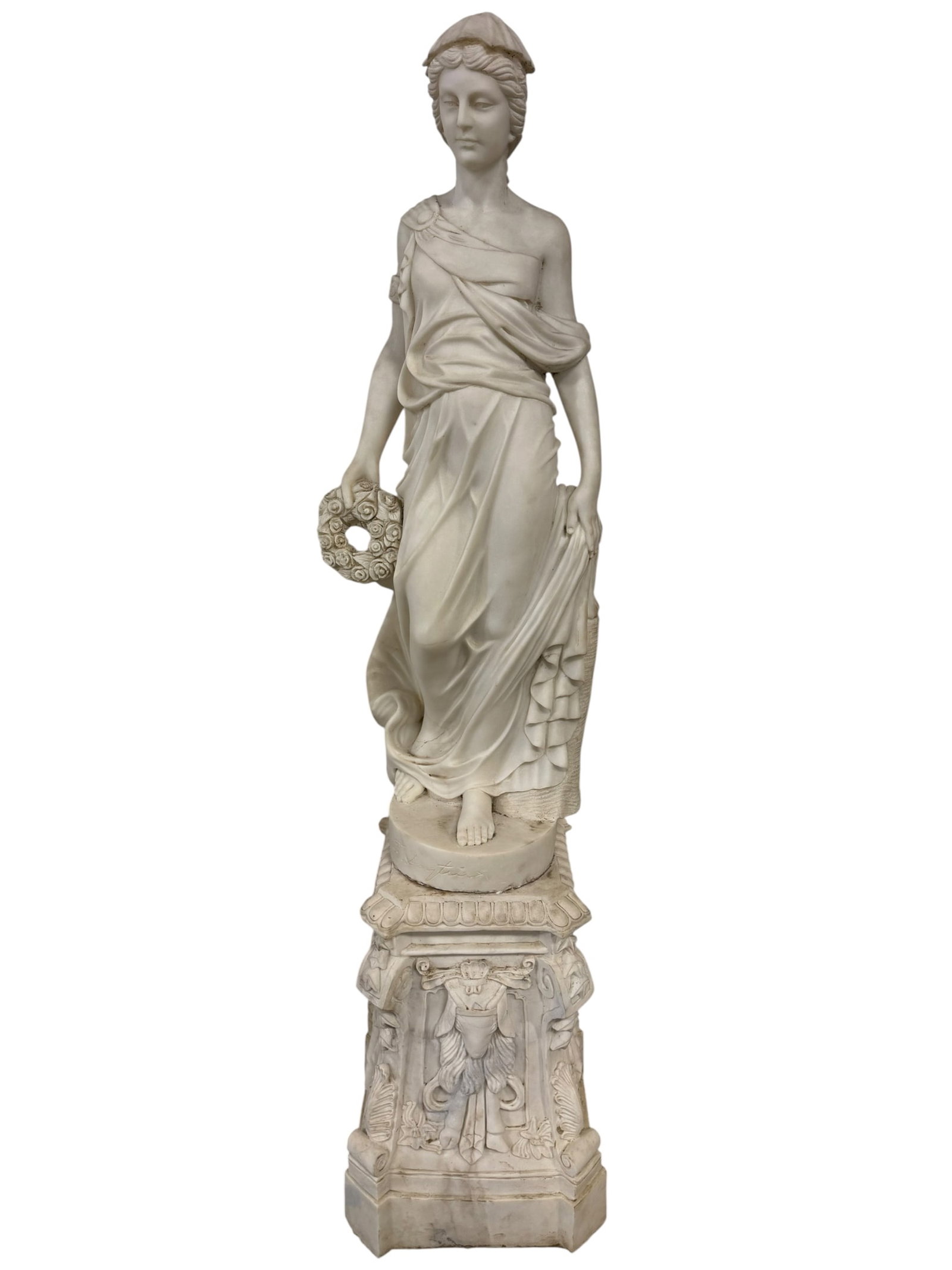 LIFESIZE FEMALE MARBLE SCULPTURE ON PEDESTAL: LIFESIZE WHITE MARBLE SCULPTURE ON PEDESTAL, FEMALE HOLDING FLORAL WREATH, HAS BEEN GLUED TOGETHER, ONE PIECE! 80" H. THIS ITEM EXCEEDS SIZE AND WEIGHT LIMITATIONS FOR SHIPPING, 500+ POUNDS, MUST BE