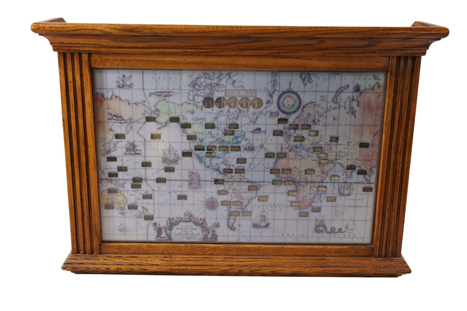 HOWARD MILLER WORLD CLOCK: ELECTRIFIED OAK CASE, MODEL 612-371 HOWARD MILLER WORLD CLOCK, 26" W x 5" D x 18" H.
