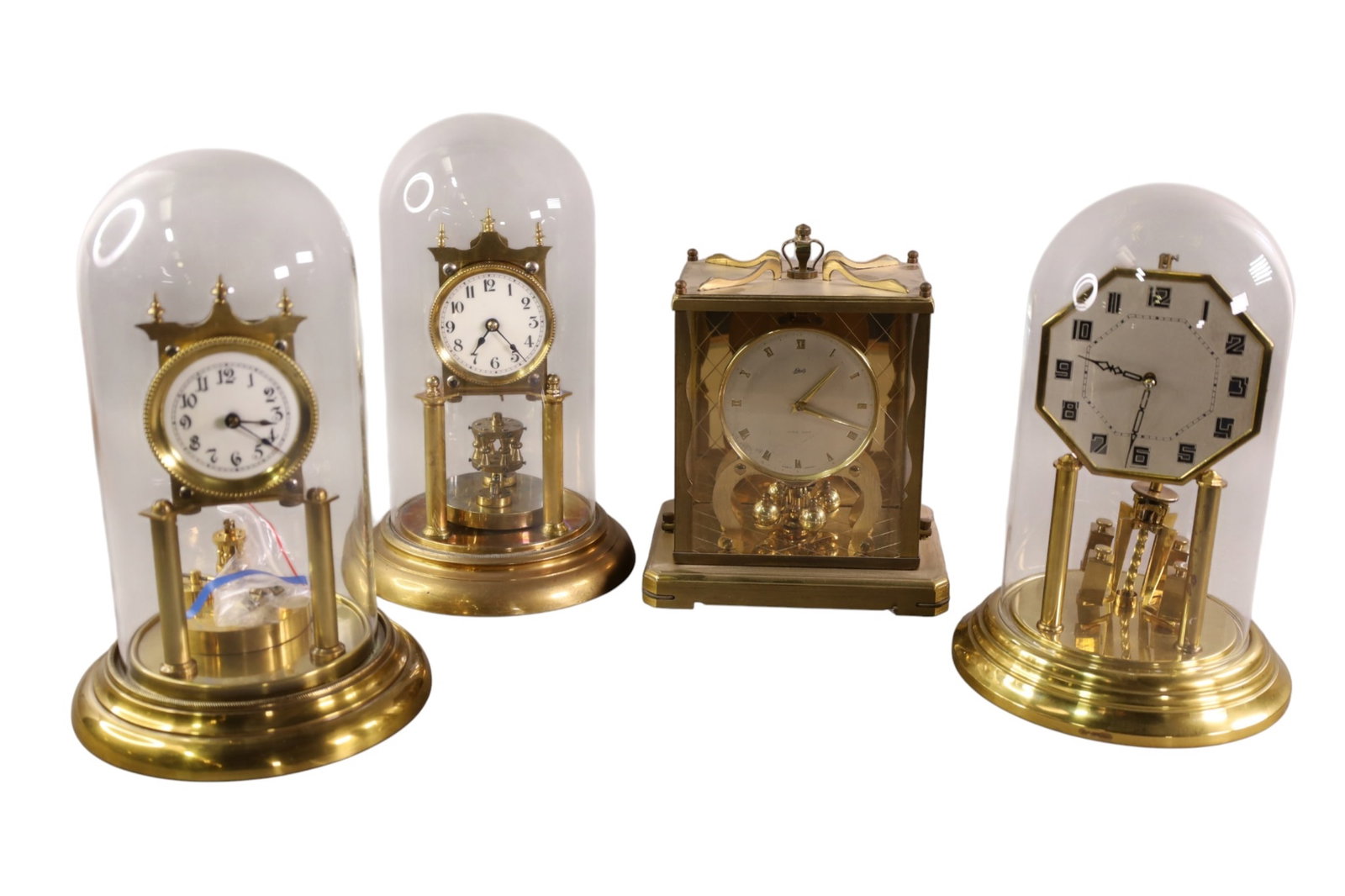 4 ANNIVERSARY CLOCKS: 3 IN GLASS DOMES, ALL CLOCKS ARE SOLD AS IS WE DO NOT GUARANTEE WORKING ORDER. 10" - 11 1/2" H.