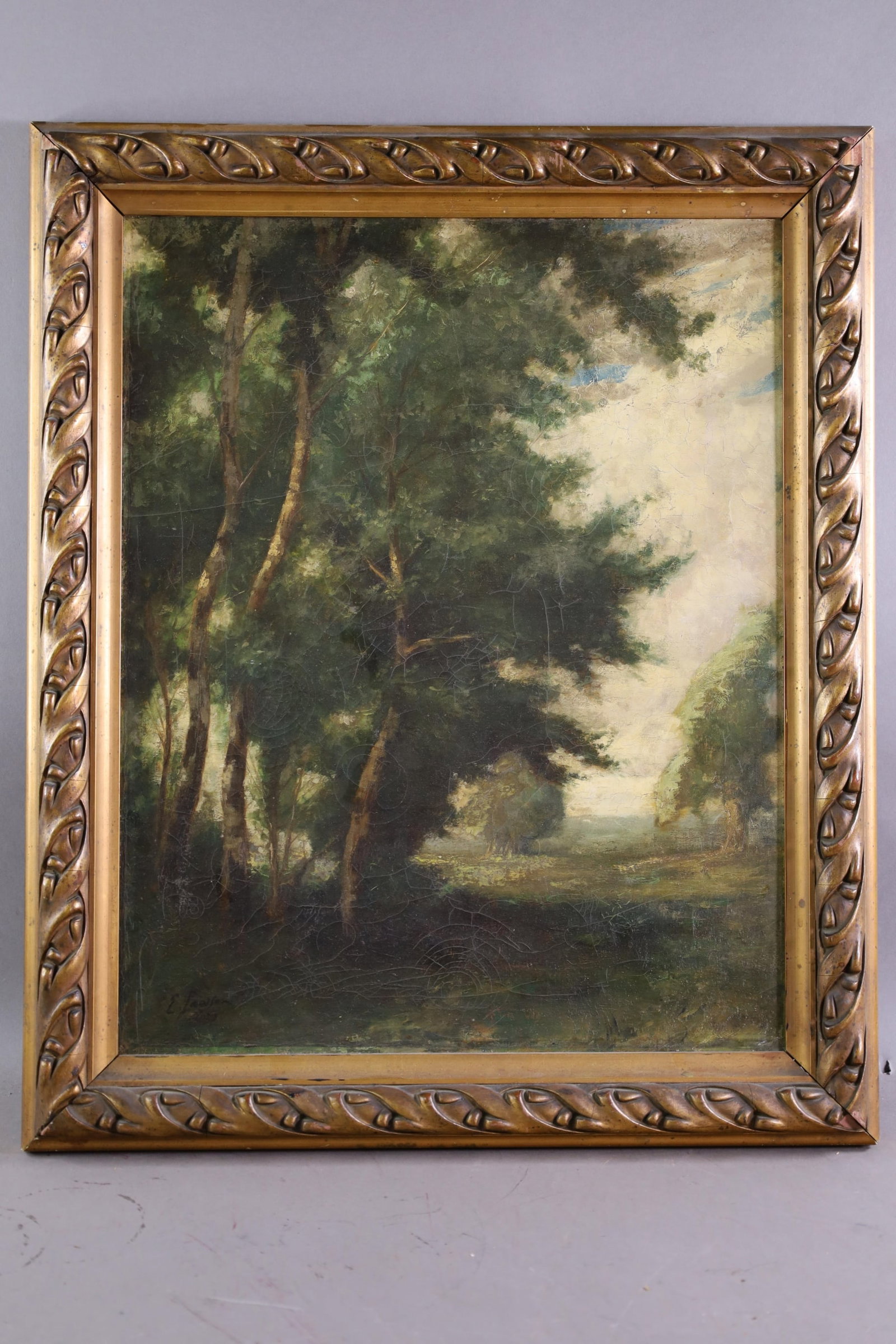 ERNEST LAWSON OIL PAINTING: OIL ON CANVAS, SIGNED LOWER LEFT. FOREST SCENE OIL PAINTING, OLD RELINE. CRAZING TO IMAGE. 16" x 20" IMAGE SIZE / 20" x 24" IN FRAME. THE WORK IS OFFERED FROM A PRIVATE COLLECTION AND IS
