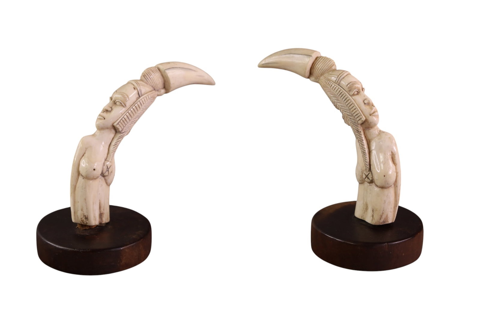 PAIR OF AFRICAN BONE CARVINGS: SMALL AFRICAN BONE CARVINGS, WOODEN BASES. 6" H.
