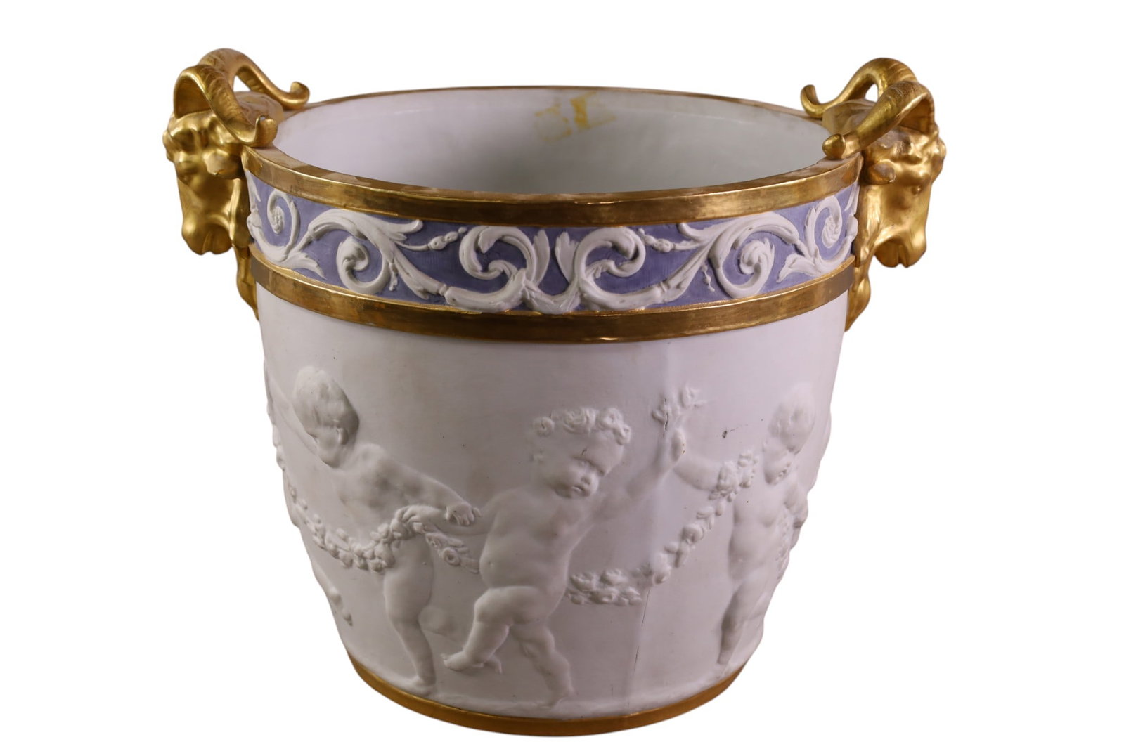 SEVRES JARDINIERE: LARGE SEVRES JARDINIERE, BISQUE PORCELAIN. RAMS HEAD DECORATED HANDLES. MARKED ON BASE. 11 1/2" DIAM x 12" H.