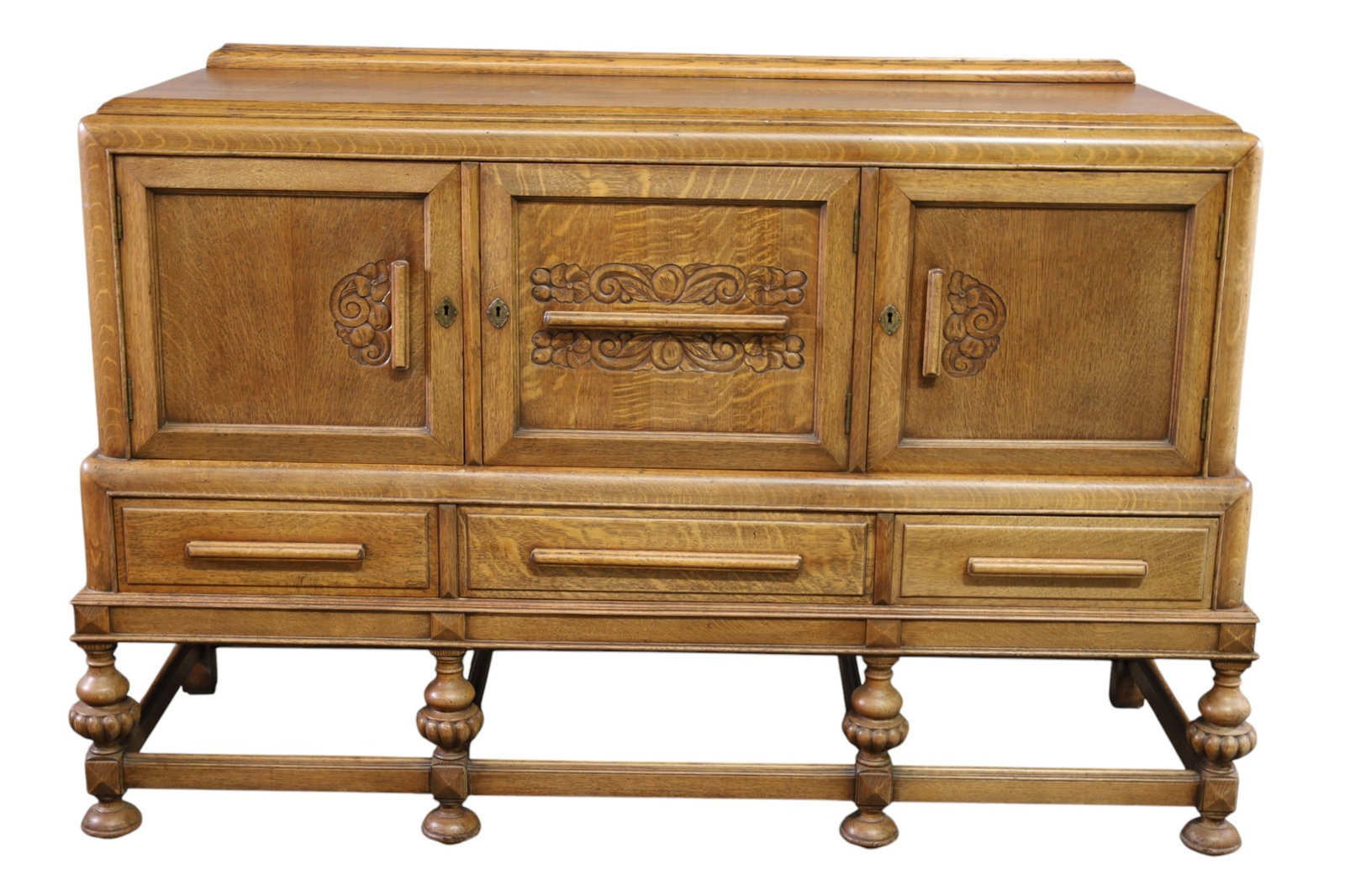 OAK BUFFET: LARGE AMERICAN OAK BUFFET, THREE DOOR WITH INTERIIOR DRAWER. 56" W x 21" D x 40" H. THIS ITEM EXCEEDS SIZE AND WEIGHT LIMITATIONS FOR IN HOUSE SHIPPING, MUST BE PICKED UP IN HOUSE OR SHIPPED VIA 3rd