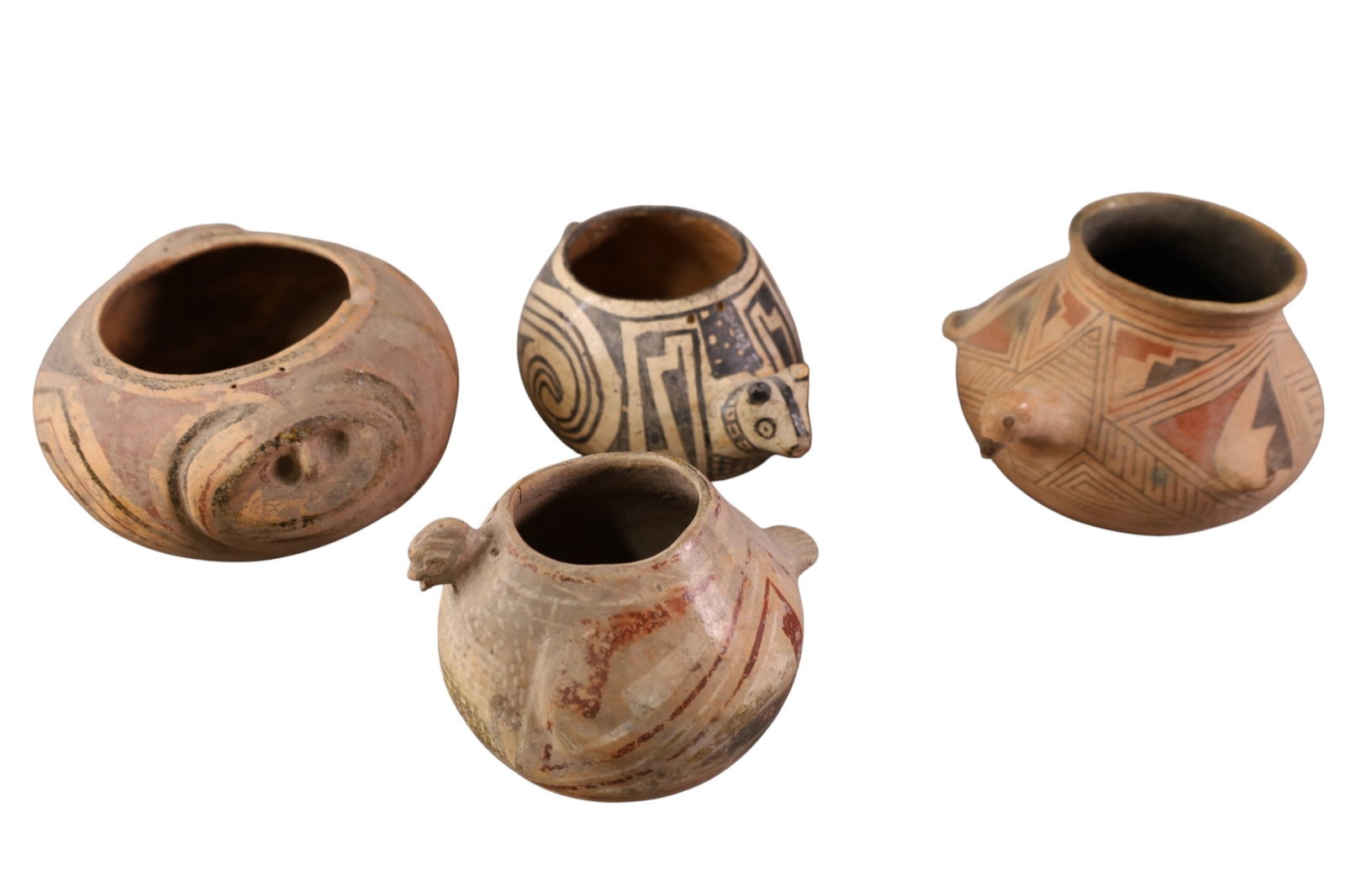 4 EFFIGY VESSELS: 4 POLYCHROME CASSAS GRANDES EFFIGY POTS, ALL HAVE BEEN REPAIRED. 4" - 5" H.