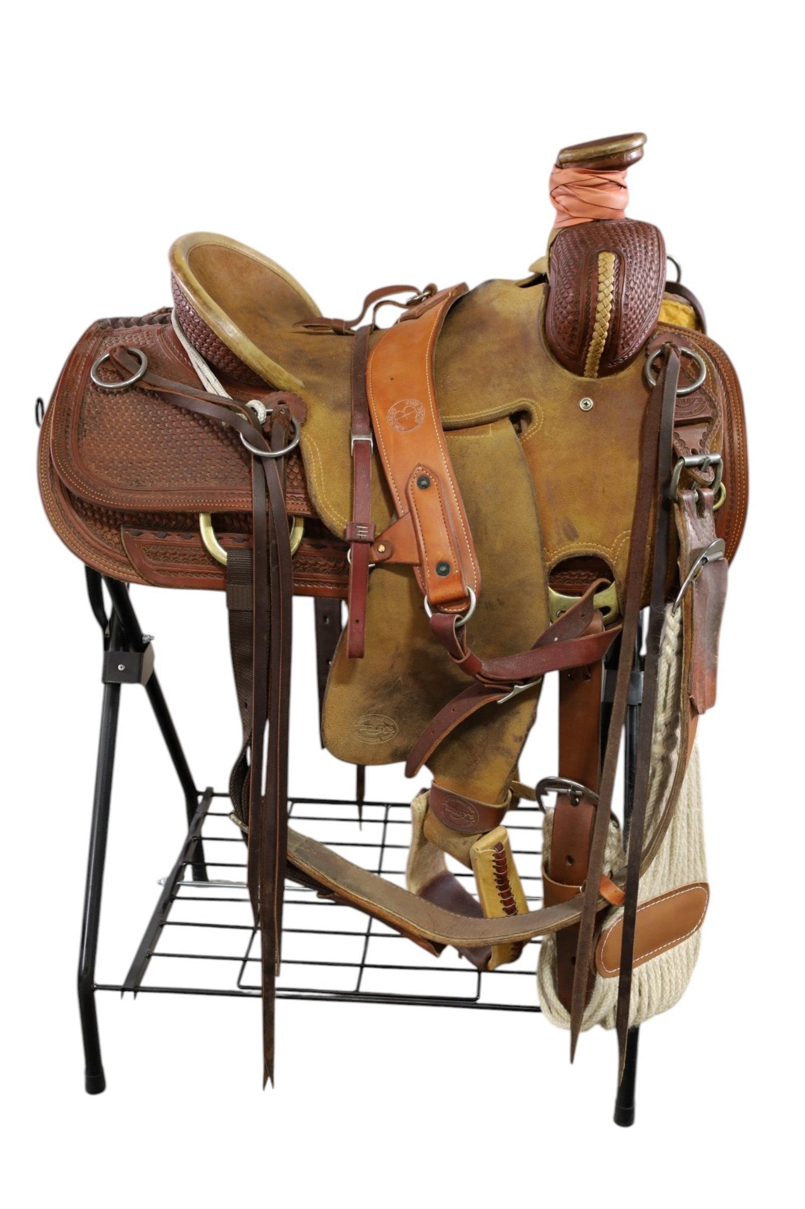 WESTERN SADDLE: MARKED TESKEY'S, TESKEY'S SADDLE SHOP, WEATHERFORD TX. WITH STAND. 15" SADDLE. THIS ITEM EXCEEDS SIZE, WEIGHT, AND OR FRAGILITY LIMITATIONS FOR IN HOUSE SHIPPING, MUST BE PICKED UP IN HOUSE OR