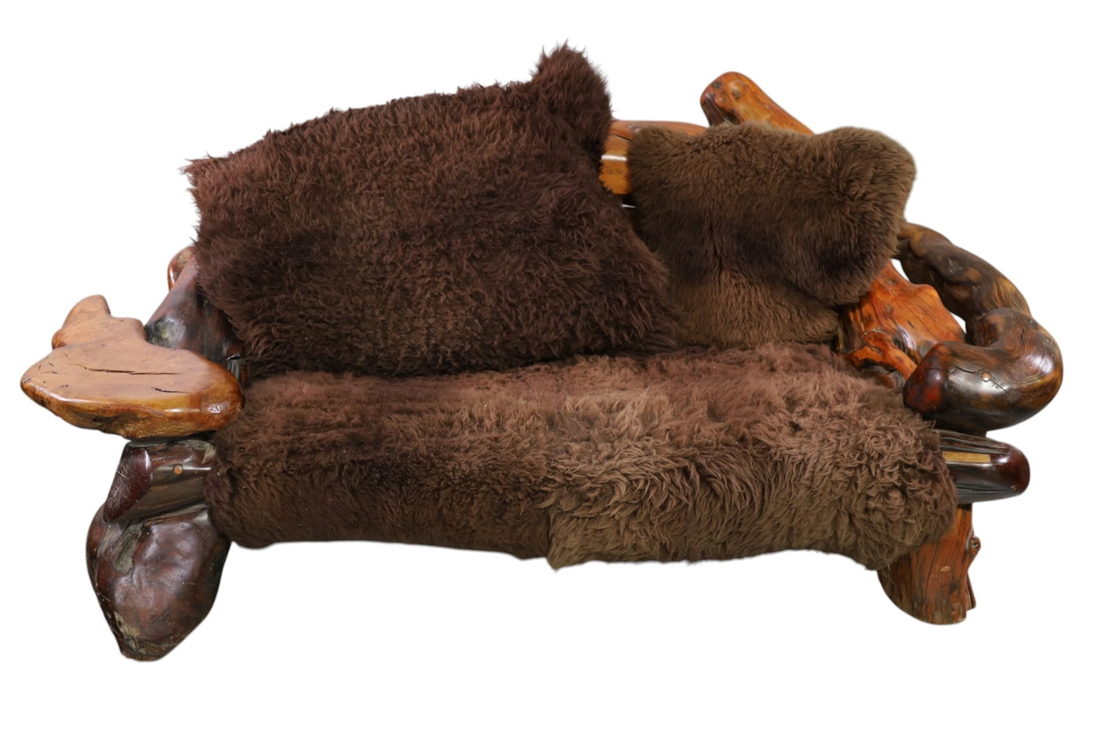 LARGE BUFFALO HIDE SETTEE: LARGE FREE FORM SCULOTED WOOD FRAME AND BUFFALO HIDE SETTEE, SIGNED KEN GREEN. 75" W x 43" W x 30" H. THIS ITEM EXCEEDS SIZE, WEIGHT, AND OR FRAGILITY LIMITATIONS FOR IN HOUSE SHIPPING, MUST BE