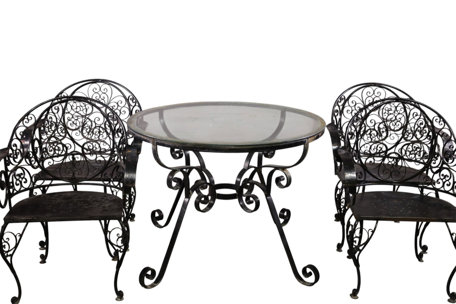 VINTAGE FANCY IRON PATIO TABLE & CHAIRS: VINTAGE PATIO SET, SET OF 4 SCROLL WORK ARMCHAIRS & LARGE GLASS TOP PATIO TABLE, IN THE STYLE OF SALTERINI. 40" DIAM x 30" H TABLE & 25 1/2" W x 18 D x 35" H. CHAIRS.. THIS ITEM EXCEEDS SIZE, WEIGHT, 