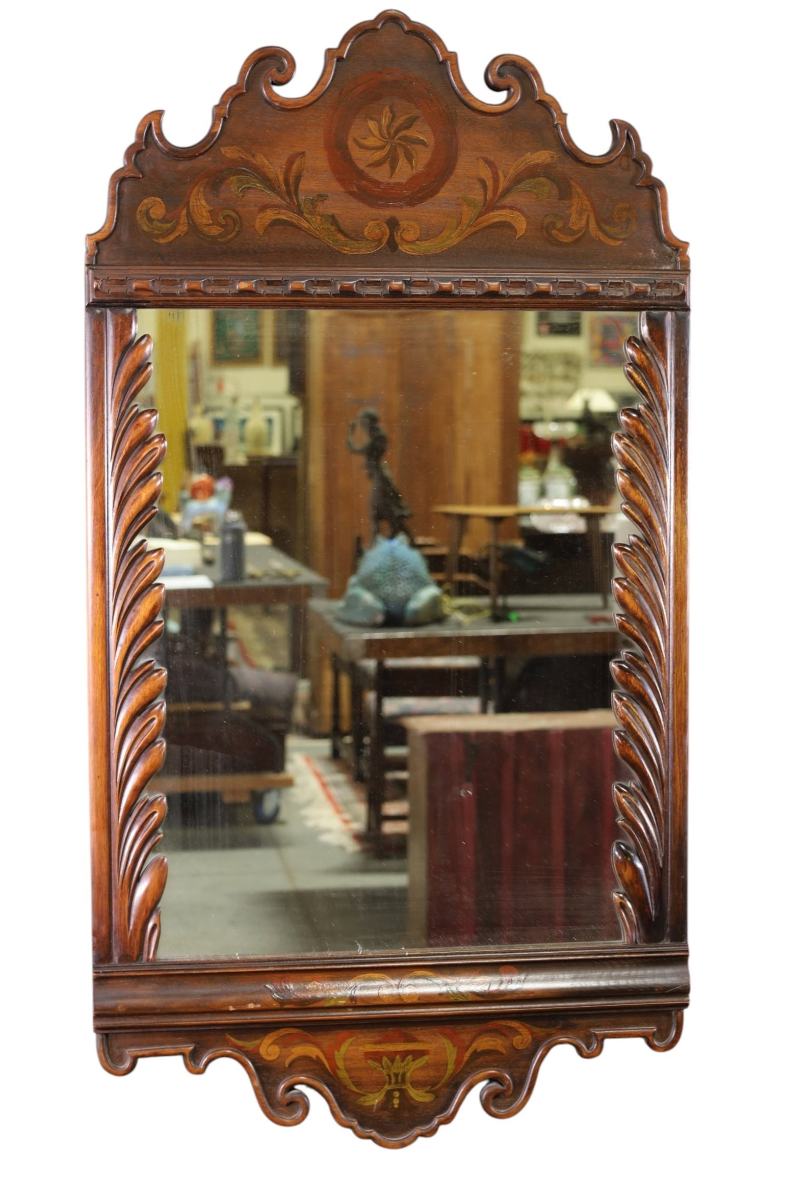 1930'S CARVED WALL MIRROR: HIGHLY CARVED WALL MIRROR, PAINTED DECORATION. 24" x 45" THIS ITEM EXCEEDS SIZE, WEIGHT, AND OR FRAGILITY LIMITATIONS FOR IN HOUSE SHIPPING, MUST BE PICKED UP IN HOUSE OR SHIPPED VIA 3rd PARTY GROUND 