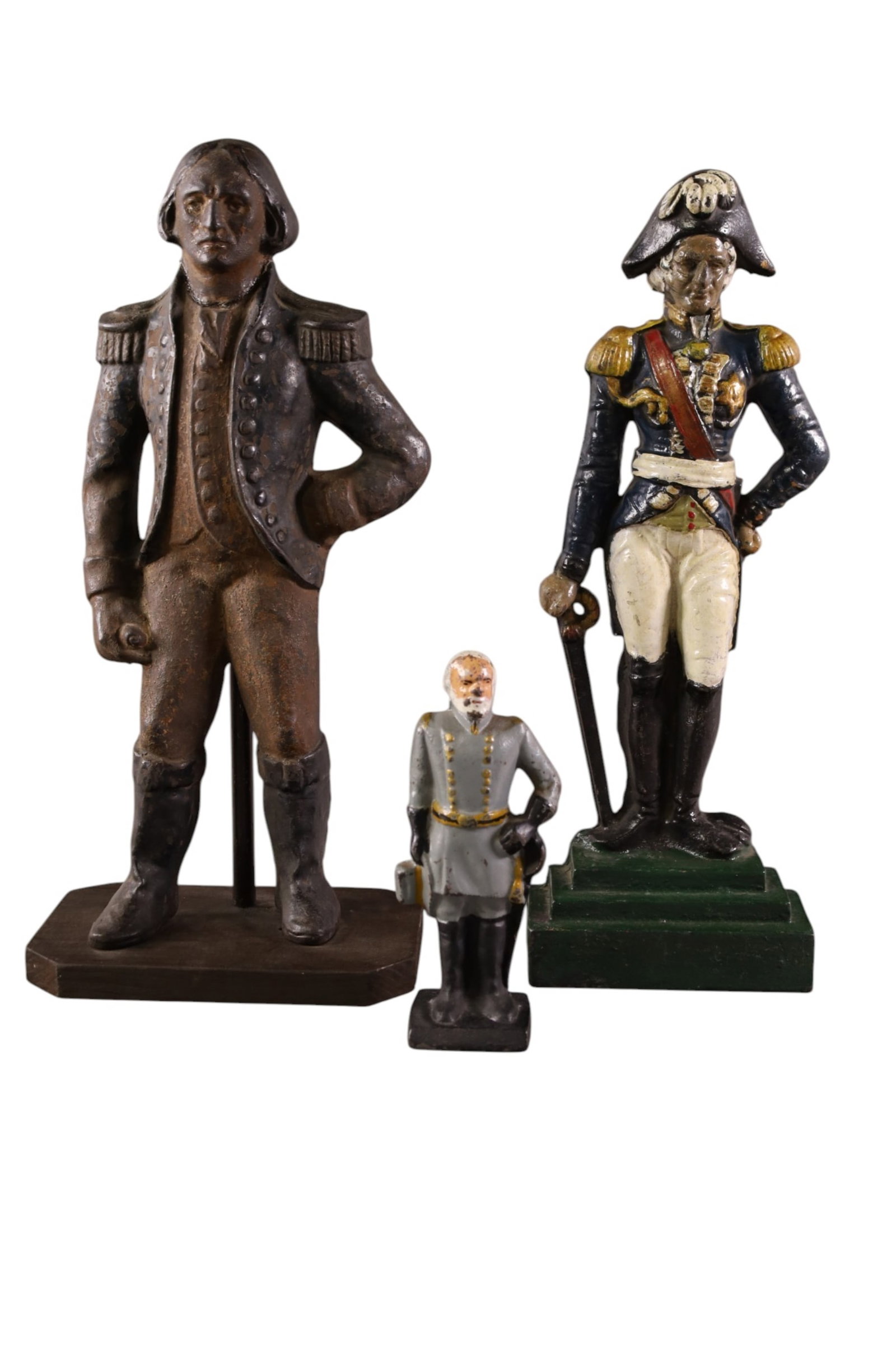 3 CAST IRON DOORSTOPS: 3 FIGURAL DOORSTOPS. GEORGE WASHINGTON HAS WOOD BASE. PAINTED FINISH. 7 1/2" - 17" H.