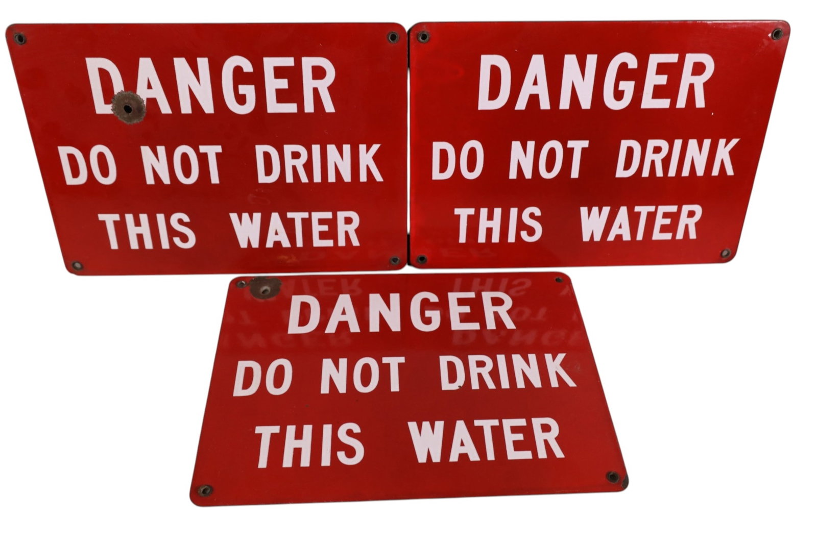 3 DANGER PORCELAIN SIGNS: 3 DANGER DO NOT DRINK THIS WATER PORCELAIN SIGNS, 2 HAVE BULLET HOLES. 14" x 10"