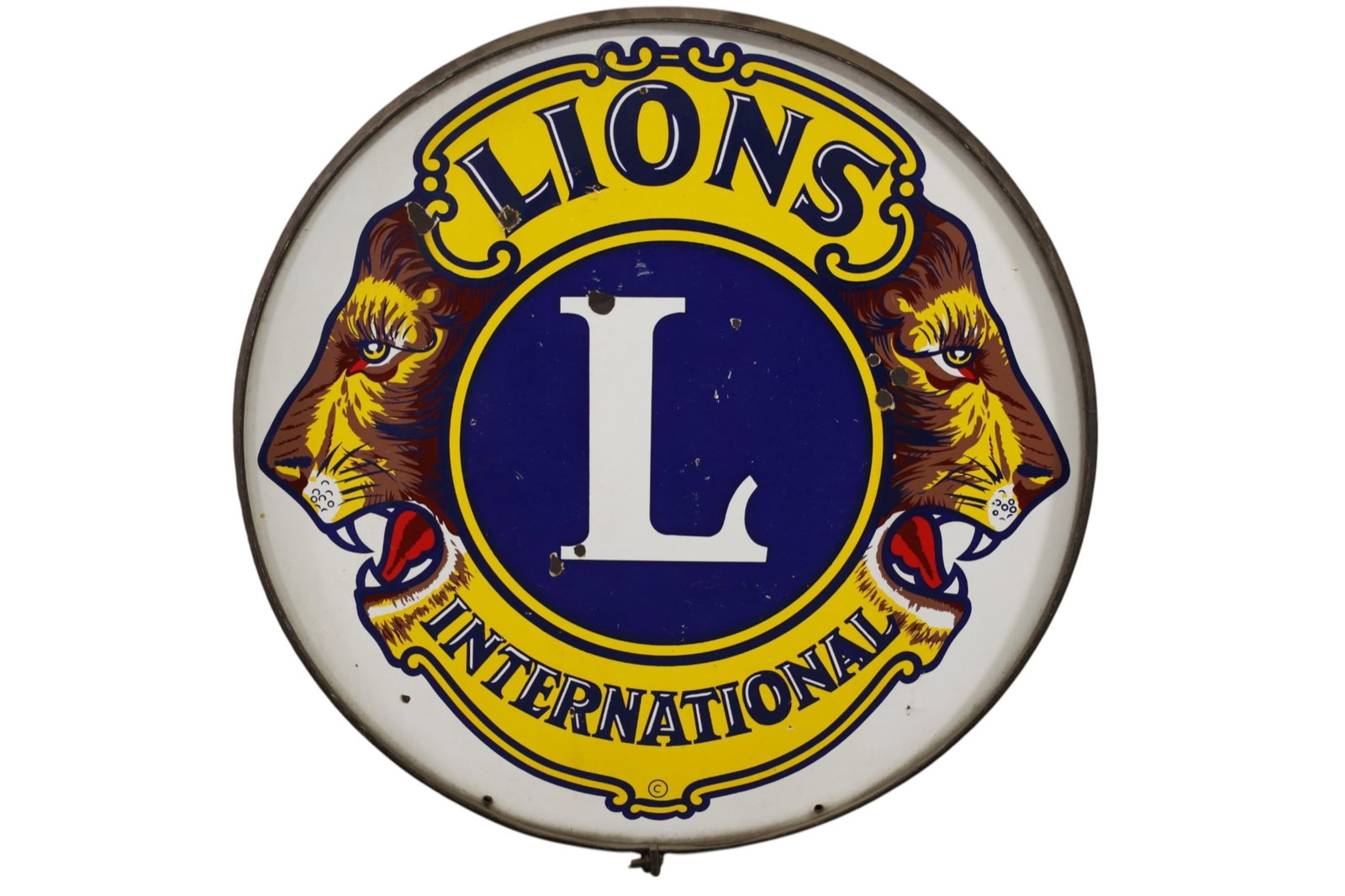 LIONS INTERNATIONAL PORCELAIN SIGN: SSP LIONS INTERNATIONAL SIGN WITH OUTER RING. CHIPS. 30" DIAM.