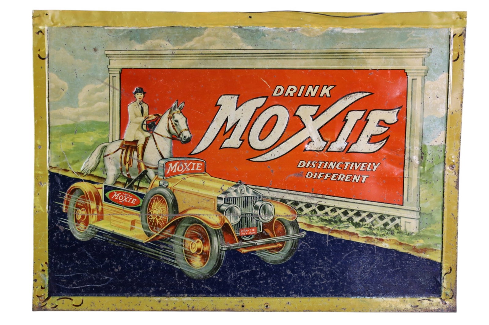 MOXIE METAL SIGN: EMBOSSED SST MOXIE, DRINK MOXIE SIGN, WITH CAR GRAPHIC. TOUCH UP PAINT. SCRATCHES. PAINT LOSS. 27" x 19"