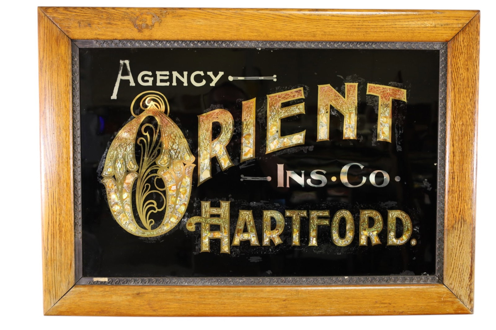 ORIENT INSURANCE CO AD: ORIENT INSURANCE CO HARTFORD, MOTHER OF PEARL INLAY. REVERSE PAINTED GLASS FRAMED AD. 33 1/2" x 24"