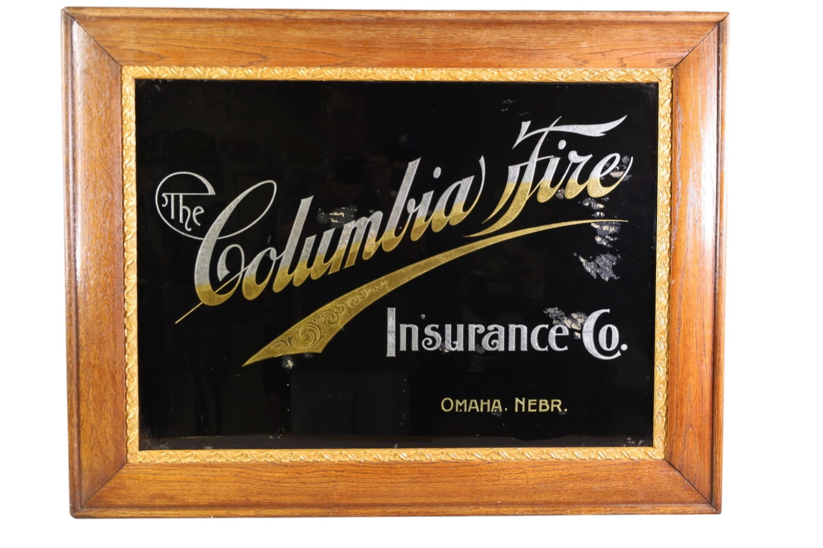 COLUMBIA FIRE INSURANCE AD: COLUMBIA FIRE INSURANCE OMAHA NEBRASKA, REVERSE PAINTED GLASS AD. SOME PAINT LOSS. 35" x 27"