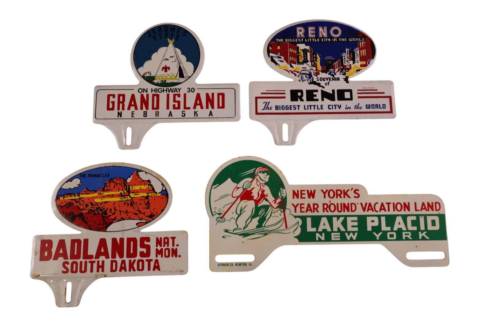 4 LICENSE PLATE TOPPERS: NEW YORK, RENO, SOUTH DAKOTA.