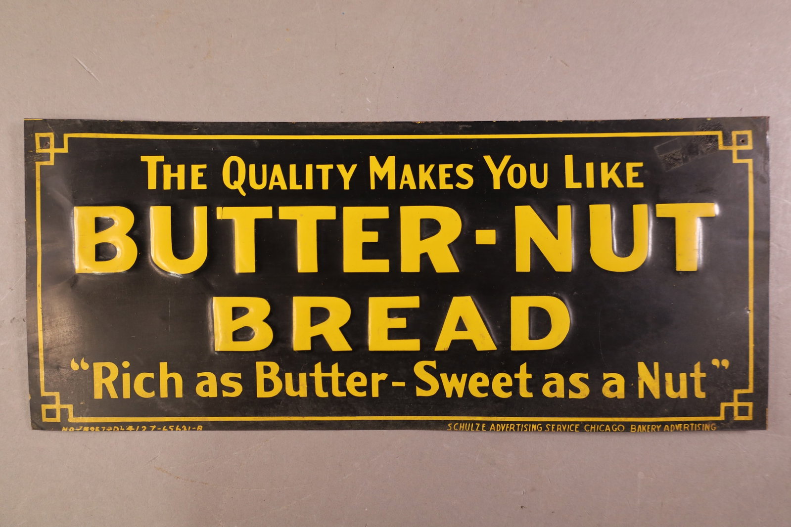 BUTTER NUT BREAD METAL SIGN: SST BUTTER NUT BREAD SIGN, CREASES. 13 3/4" x 5 3/4"