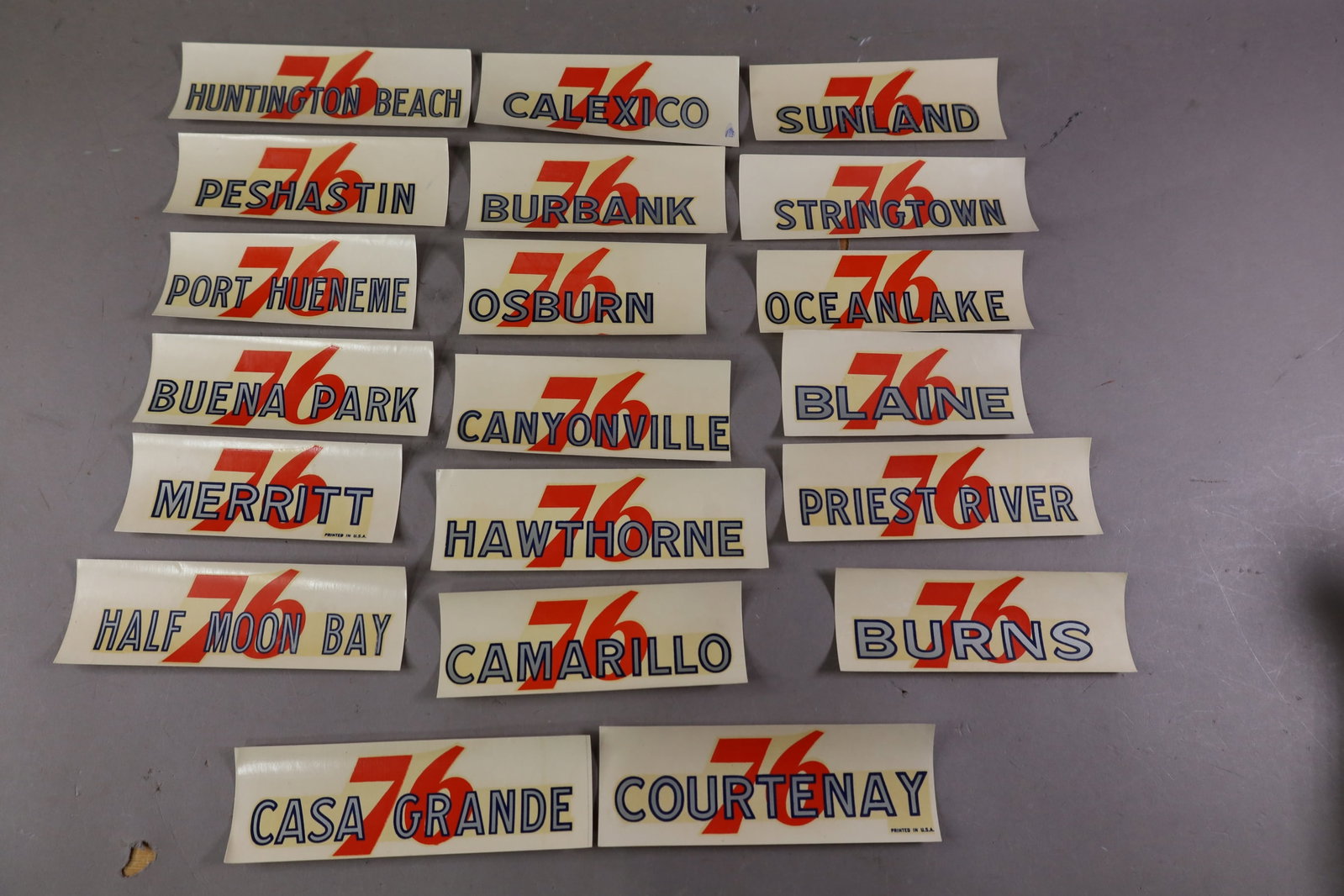 20 UNION 76 WATER TRANSFER DECALS: INCLUDING, HUNTINGTON BEACH, BURBANK AND MORE. EDGES ARE CURLED.