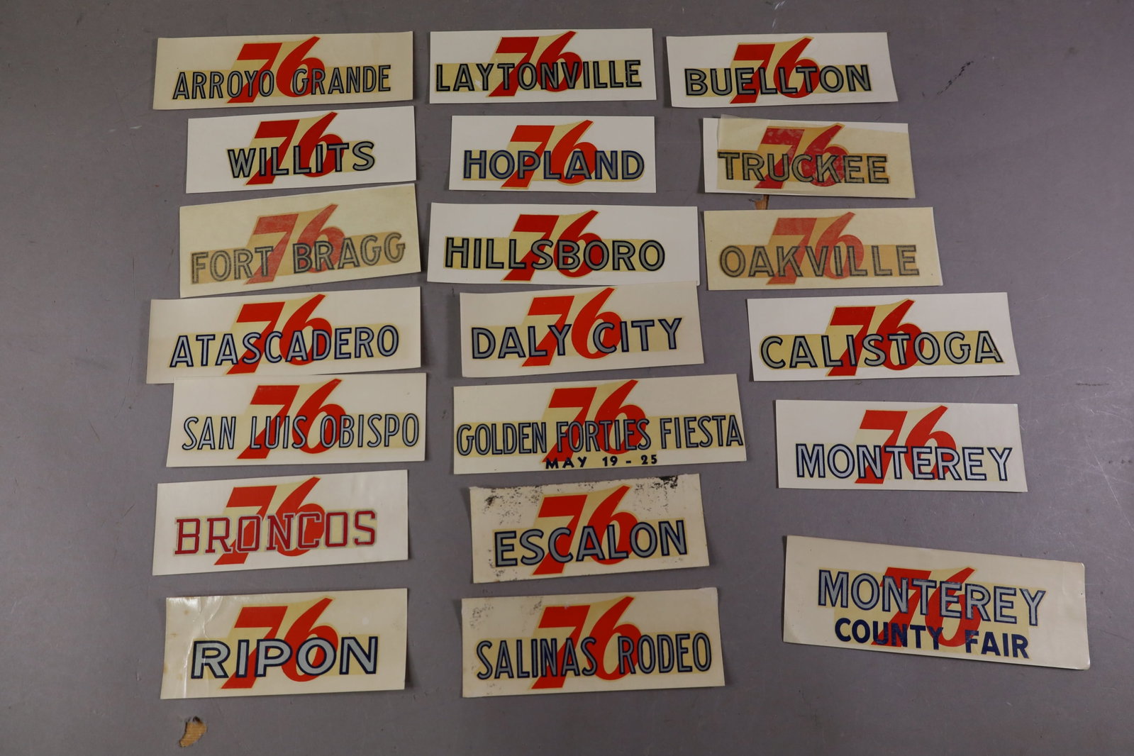 20 UNION 76 WATER TRANSFER DECALS: INCLUDING, FORT BRAGG, HOPLAND, ARROYO GRANDE AND MORE. EDGES ARE CURLED.
