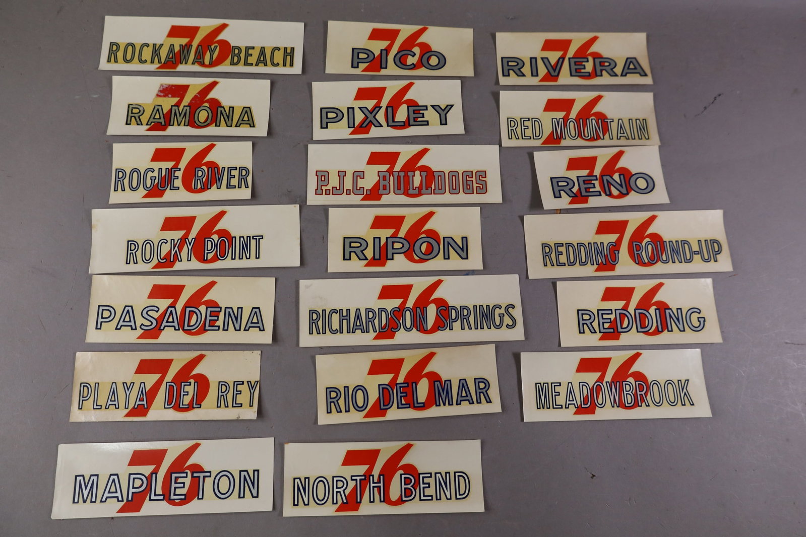 20 UNION 76 WATER TRANSFER DECALS: INCLUDING, RIPON, RIO DEL MAR, PIXLEY, AND MORE. EDGES ARE CURLED.