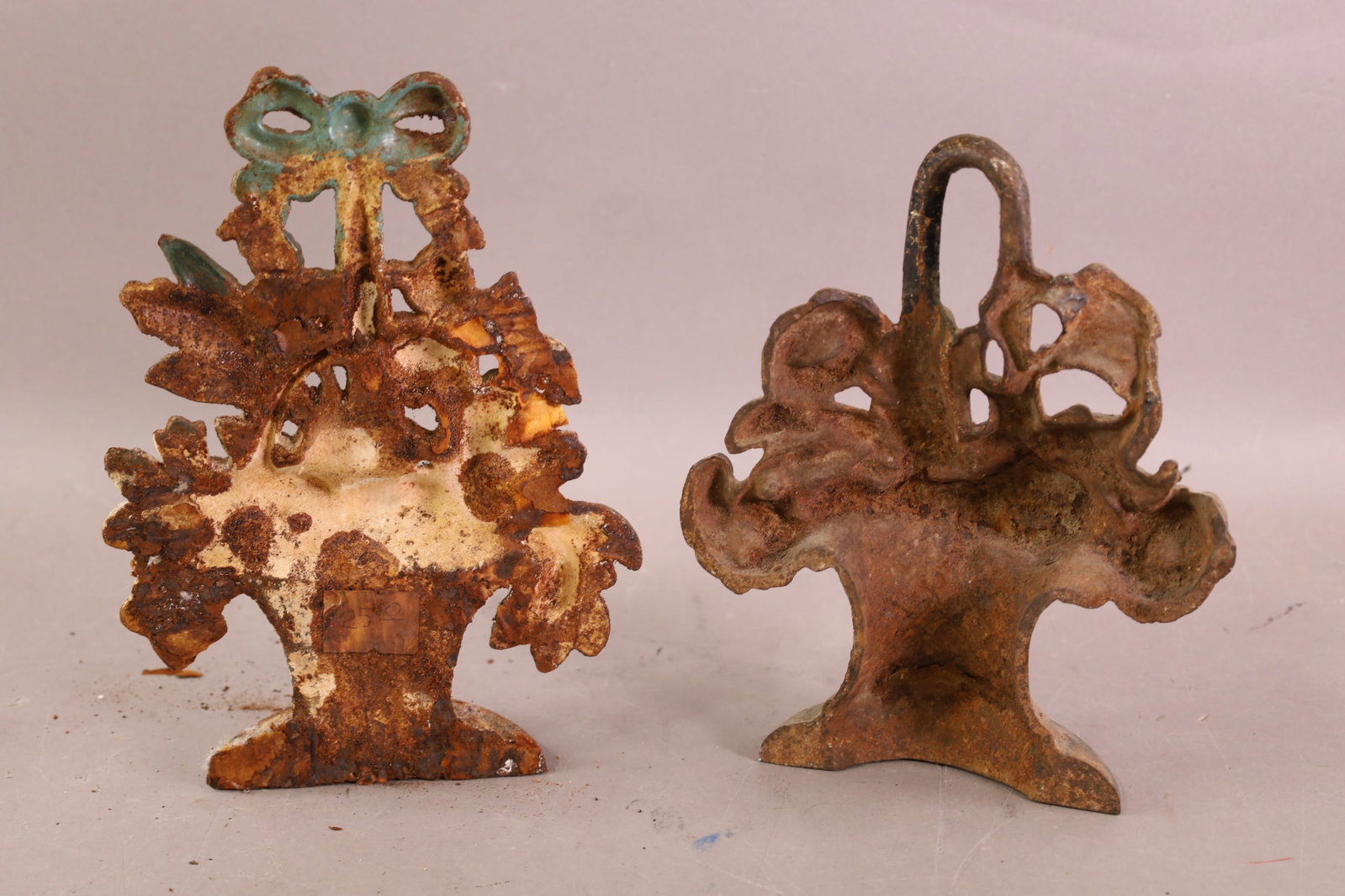 2 CAST IRON DOORSTOPS - 2