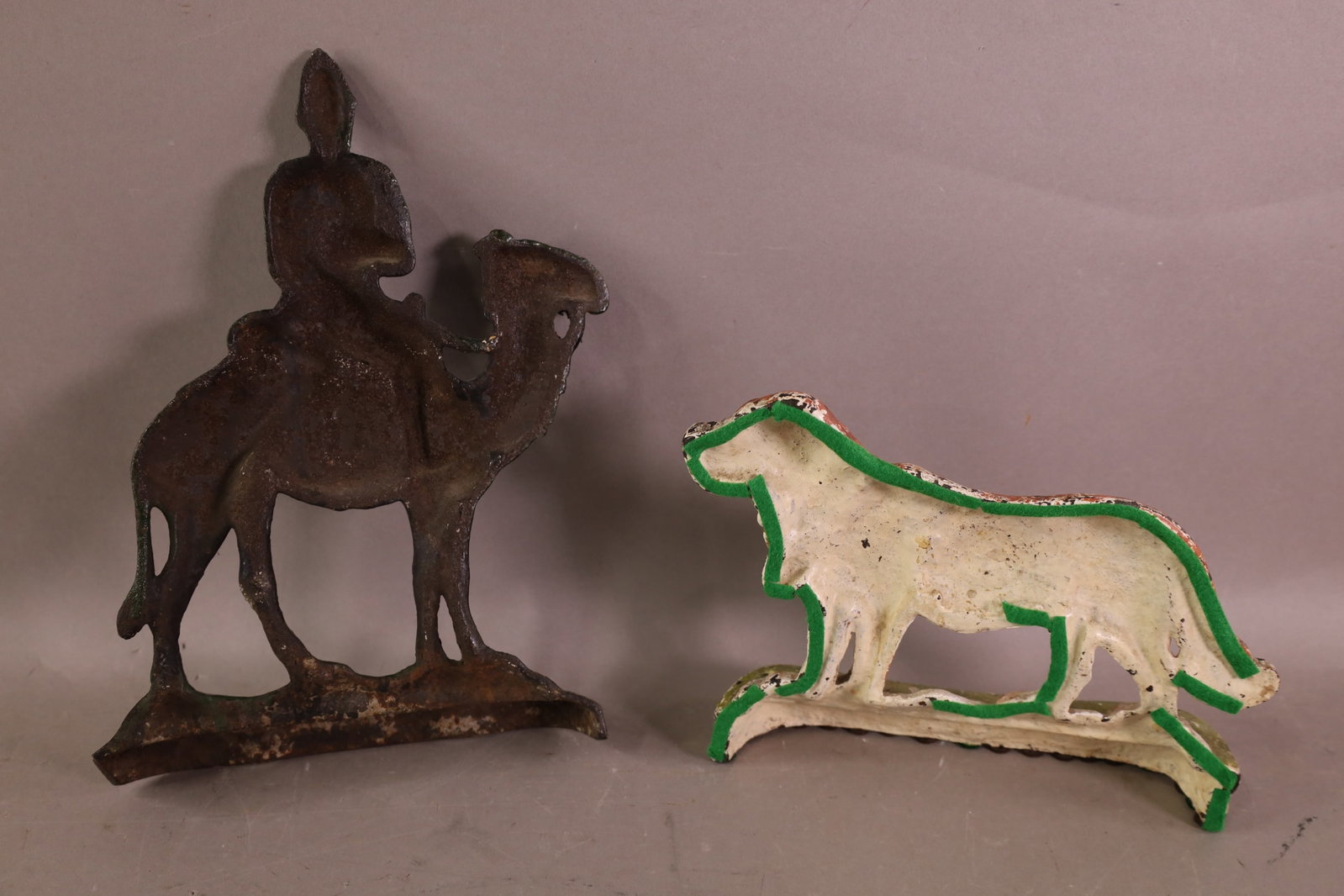 2 CAST IRON DOORSTOPS - 2