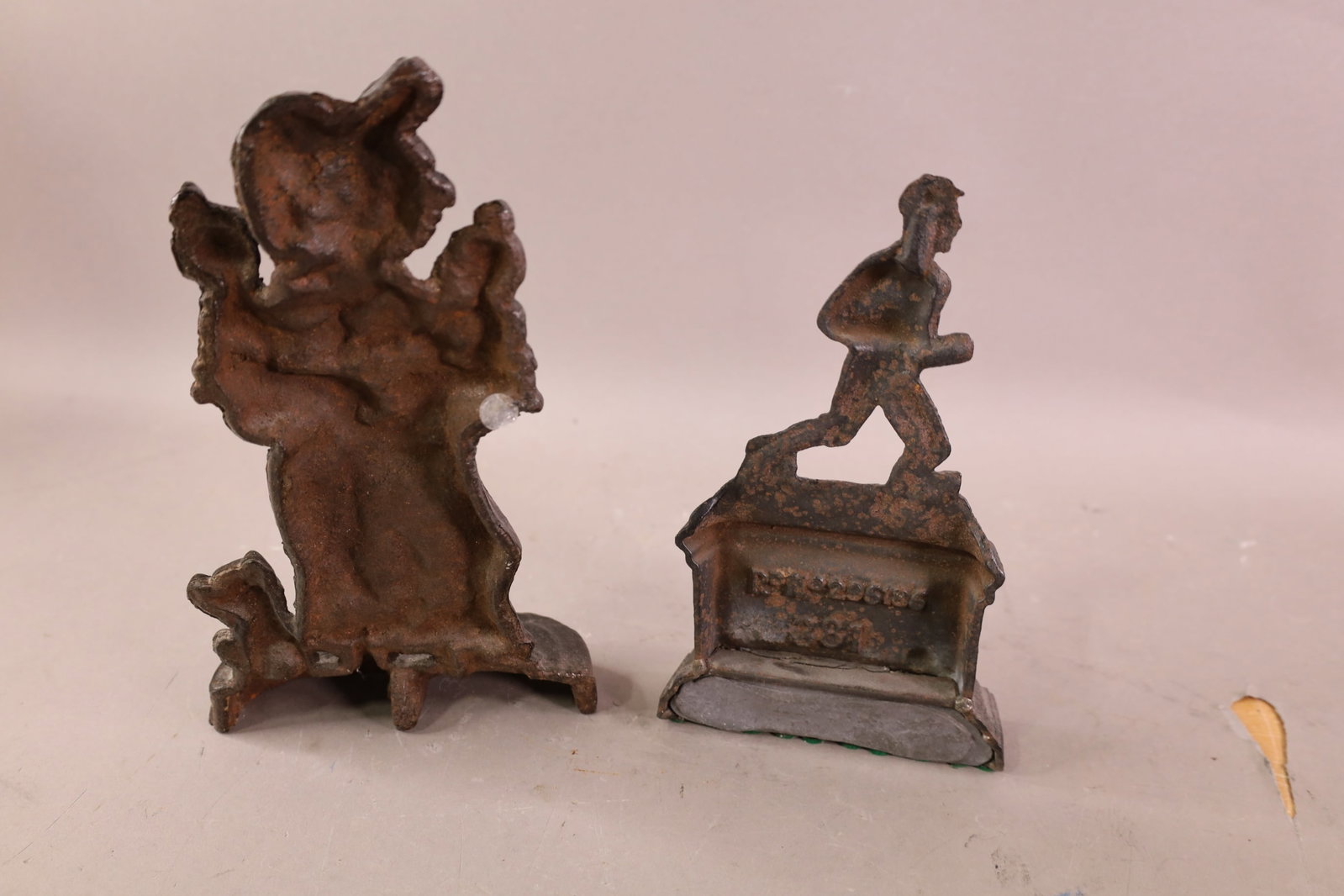 2 CAST IRON DOORSTOPS - 4