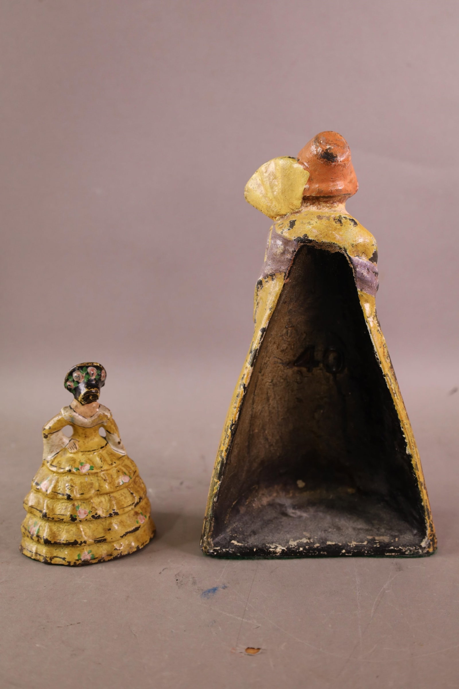 2 CAST IRON DOORSTOPS - 2