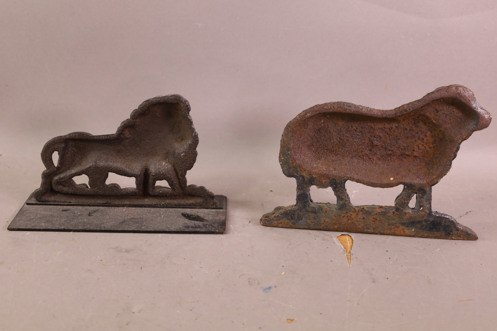 2 CAST IRON DOORSTOPS - 2