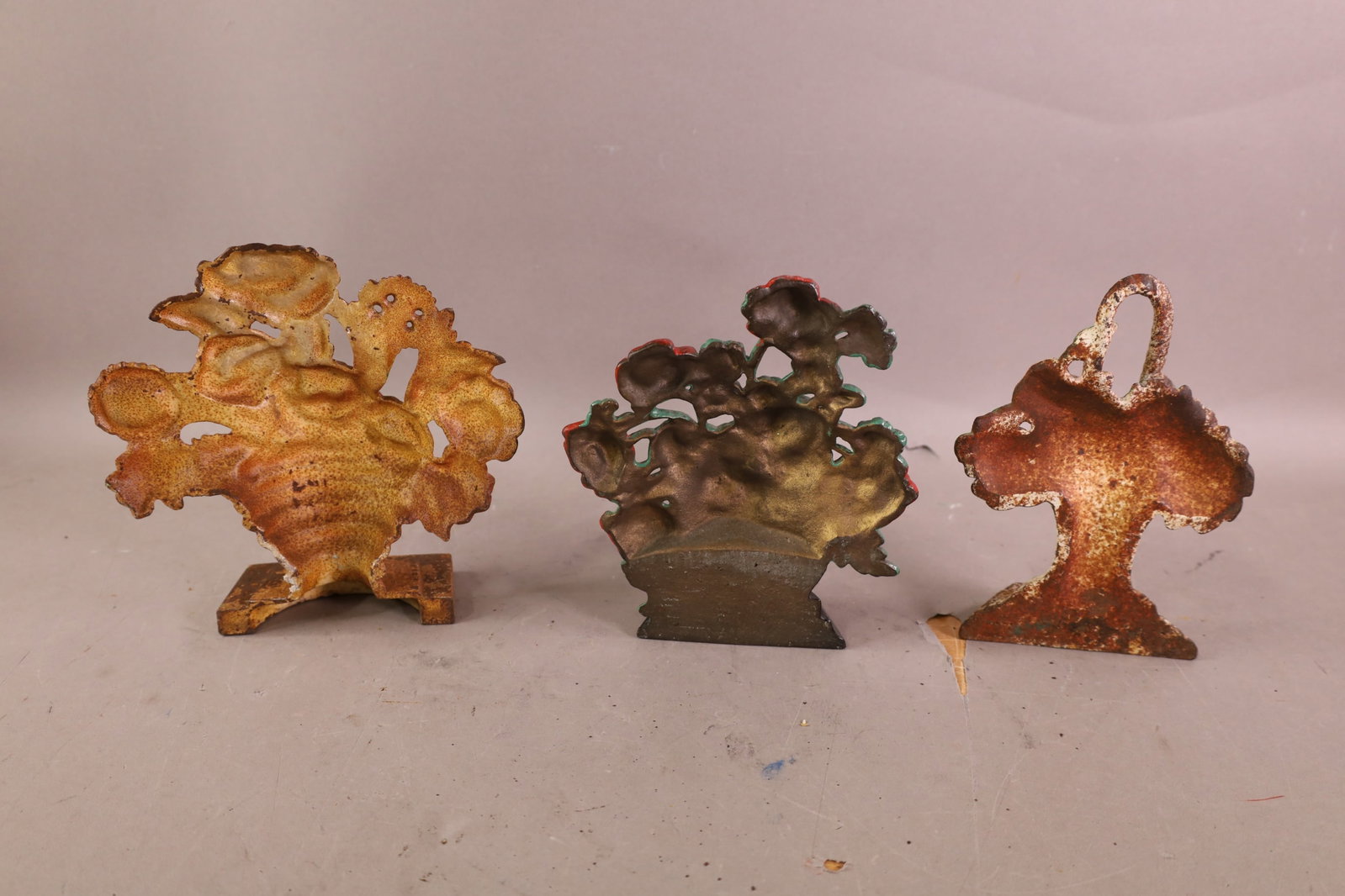 3 CAST IRON DOORSTOPS - 2