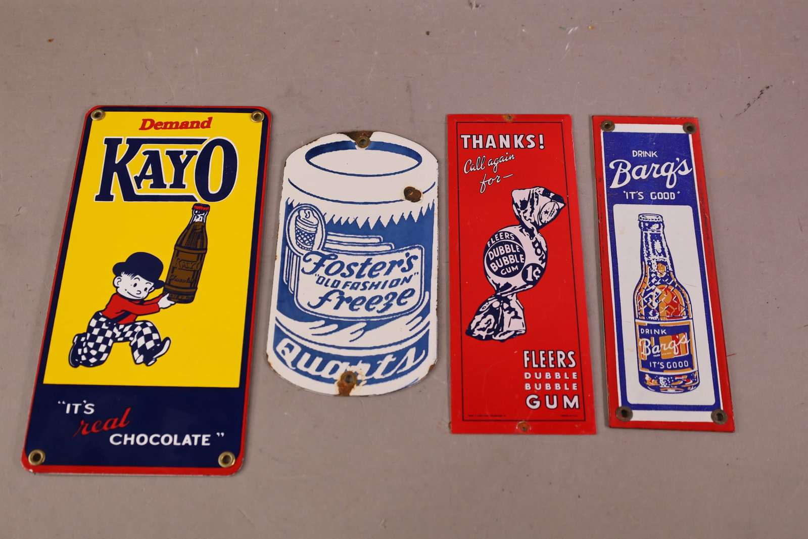 4 SMALL PORCELAIN SIGNS: REPRODUCTION SIGNS, FOSTERS, KAYO. 8" - 11"