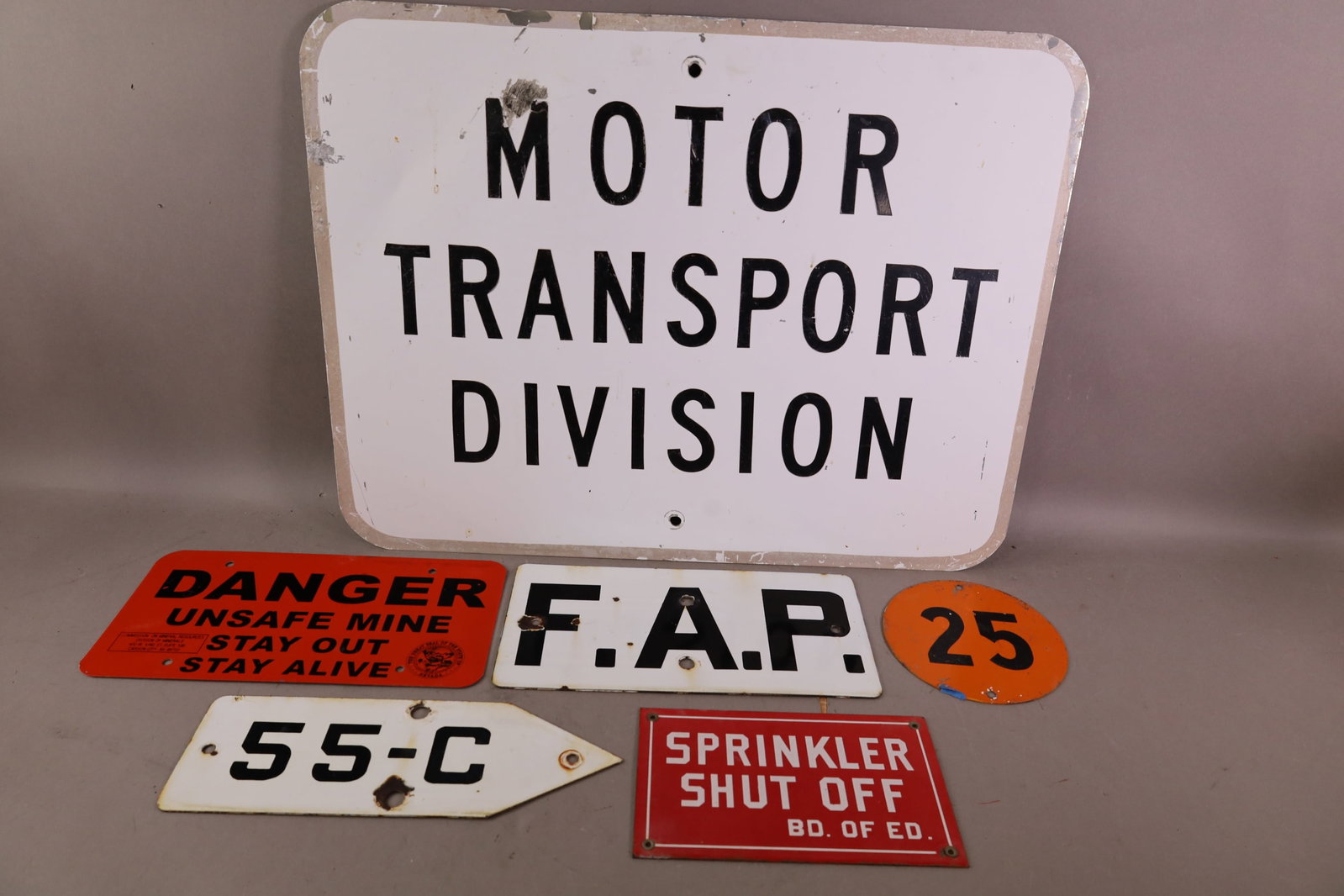MISC SIGNS: NEVADA DANGER MINE, UNION 76 NUMBER 25, ROAD, AND MORE.