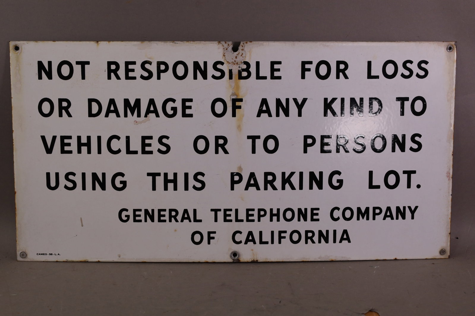 GENERAL TELEPHONE PORCELAIN SIGN: SSP GENERAL TELEPHONE SIGN, SOME STAINS, CHIPS. 24" x 12"