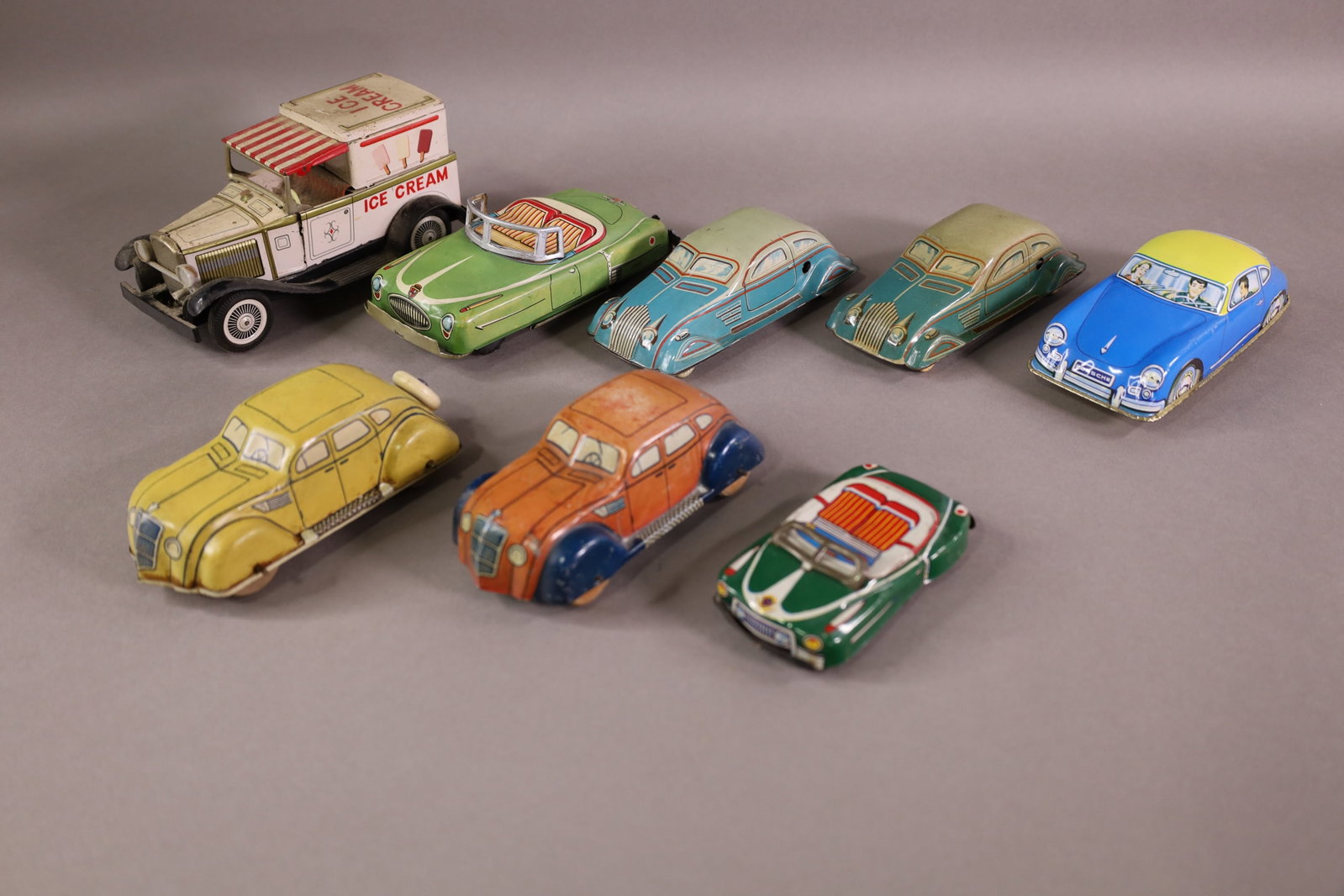 8 TIN LITHO TOYS: 7 CARS & 1 ICE CREAM TRUCK, FRICTION TOYS. PLAYED WITH CONDITION. 4" - 6"