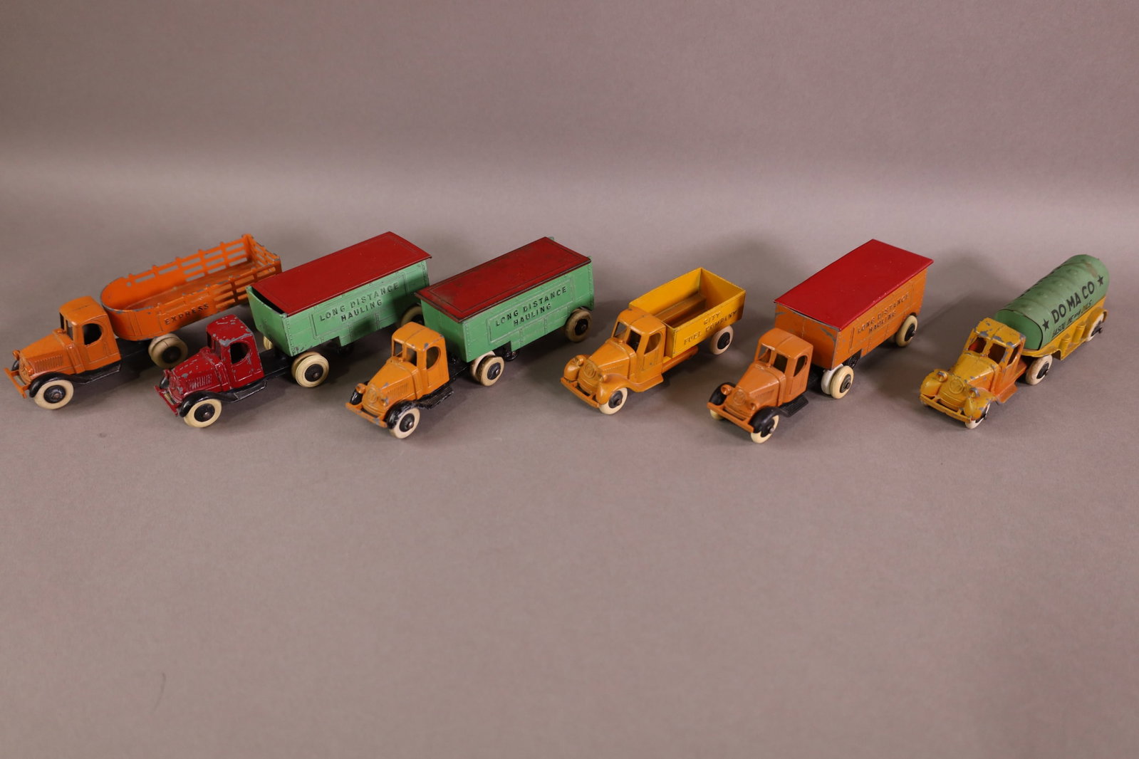 6 TOOTSIETOY TRUCKS: TOOTSIETOY TRUCKS, LONG DISTANCE HAULING, TANKER, EXPRESS, ONE IS MISSING AXEL. 4" - 5 1/2"