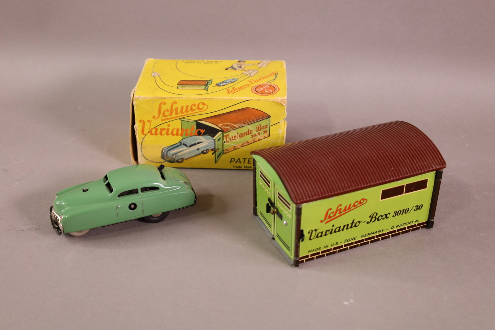 SCHUCO VARIANTO CAR: CAR WITH GARAGE, IN ORIGINAL BOX, MISSING FLAP. NO KEY. 4" L