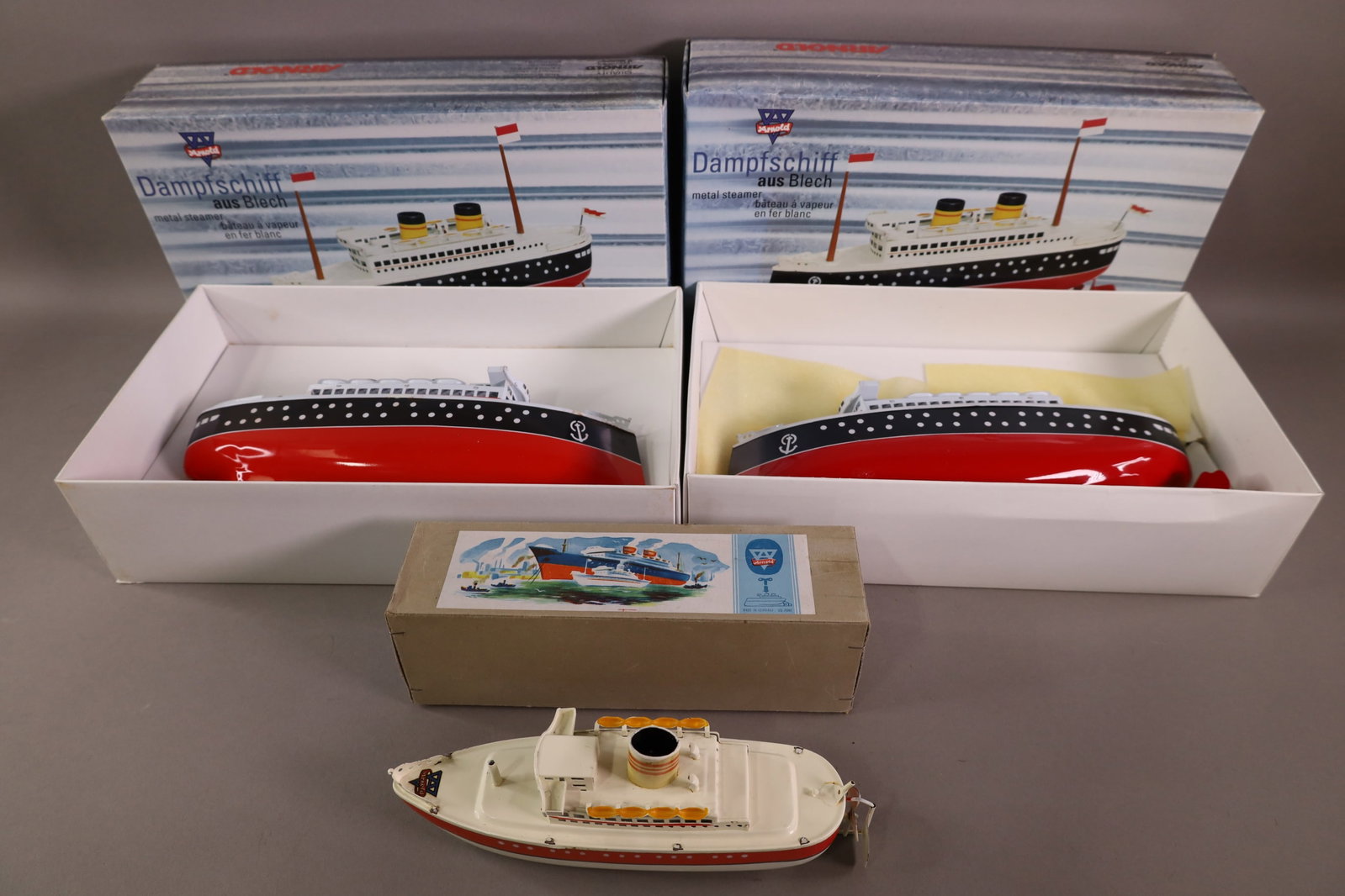 3 GERMAN ARNOLD BOATS: WIND UP BOATS, IN ORIGINAL BOXES. NO KEYS. 9" & 11 1/2"