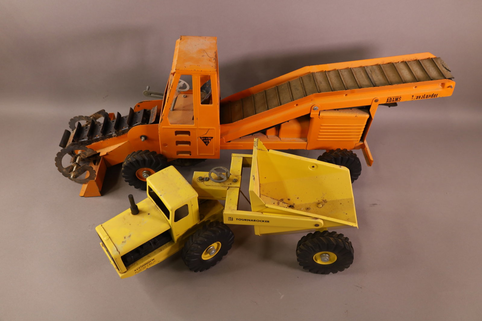 2 NYLINT TOYS: TRAVELOADER, & TOURAROCKER. RUST AND PAINT LOSS. 18" - 30"