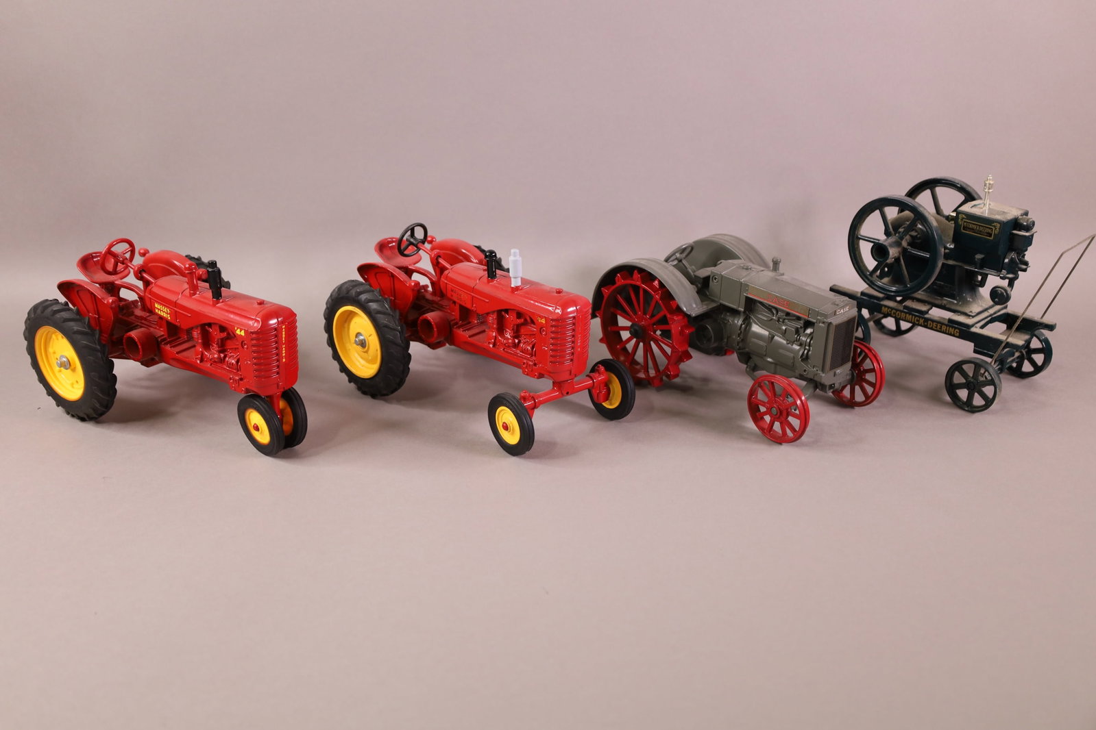 3 TOY TRACTORS & MOTOR: 2 ERTL TRACTORS & ERTL CASE, & ERTL MCCORMICK DEERING. 7" & 8" L