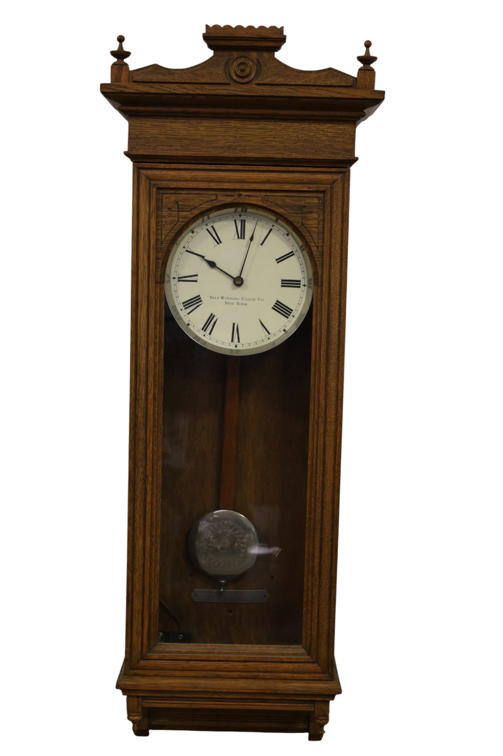 SELF WINDING CLOCK CO WALL CLOCK: SELF WINDING CLOCK CO NEW YORK WALL CLOCK. 45" H. BATTERY ADDED. ALL CLOCKS ARE SOLD AS IS WE DO NOT GUARANTEE WORKING ORDER. THIS ITEM EXCEEDS SIZE, WEIGHT, AND OR FRAGILITY LIMITATIONS FOR IN HOUSE