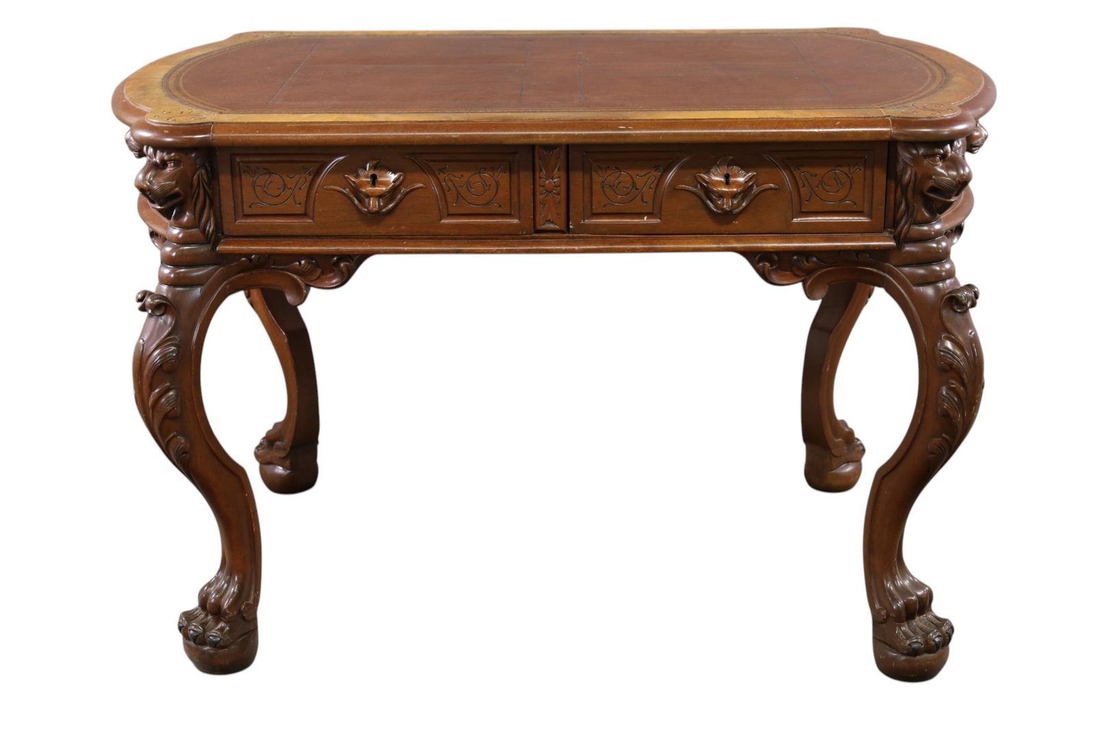VICTORIAN CARVED 2 DRAWER WRITING DESK: CARVED VICTORIAN 2 DRAWER WRITING DESK, LION CARVING. LEATHER TOP. REFINISHED. LIGHT SCRATCHES. 49" W x 30" D x 31" H. ALL CLOCKS ARE SOLD AS IS WE DO NOT GUARANTEE WORKING ORDER. THIS ITEM EXCEEDS SI
