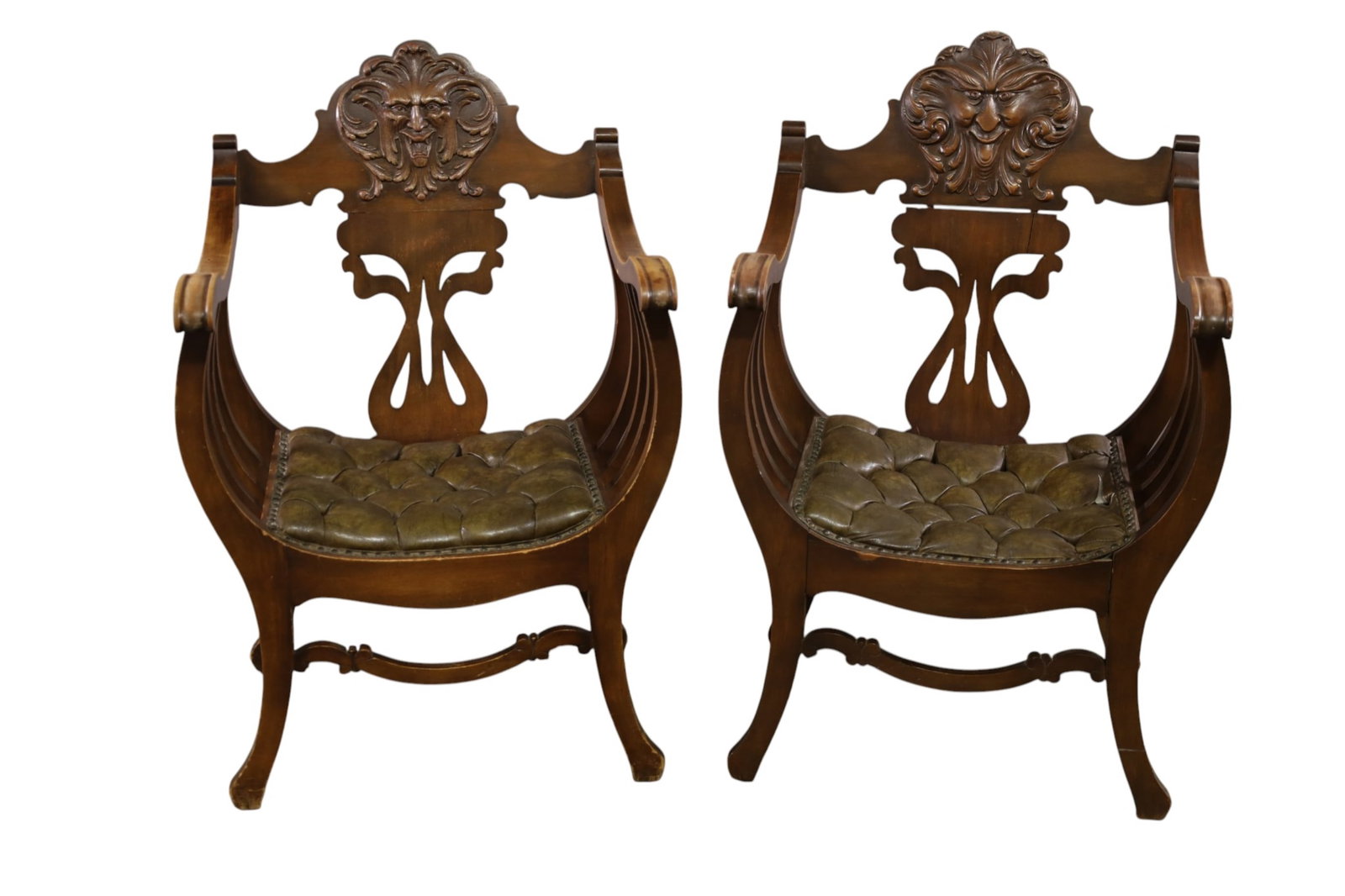 PAIR OF ANTIQUE ROMAN STYLE ARMCHAIRS: PAIR OF ROMAN STYLE BARREL CHAIRS, CARVED BACKS, TUFTED SEATS, MINOR WEAR TO FINISH. CRACK TO BACK OF ONE CHAIR. TEAR TO UPHOLSETRY 23 1/2" W X 23" D x 37" H. THIS ITEM EXCEEDS SIZE, WEIGHT, AND OR