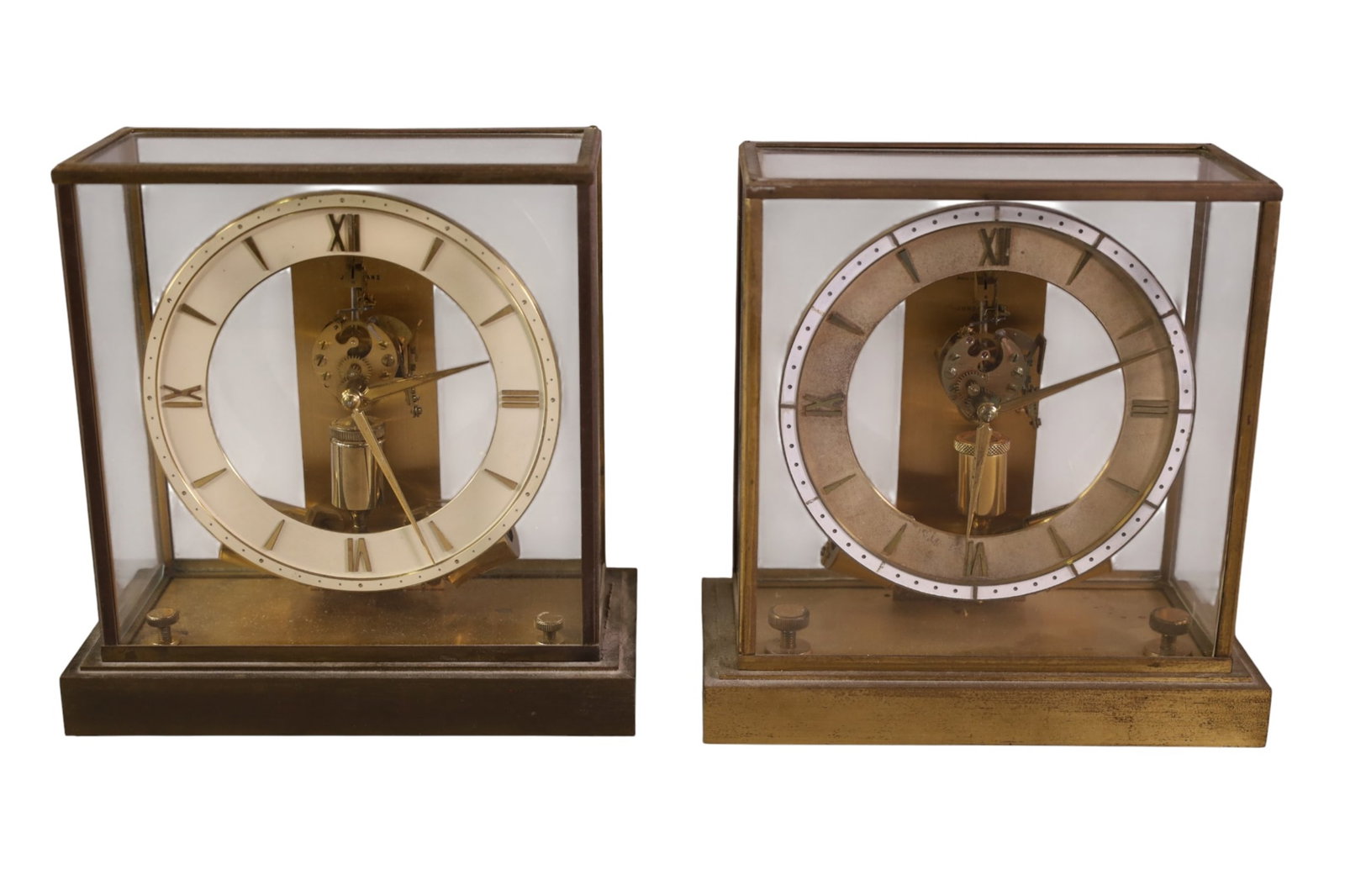 2 JUNGHANS MANTLE CLOCKS: JUNGHANS MANTLE CLOCKS IN BRASS CASES. 1 GLASS & 1 IS PLASTIC. 9" H. ALL CLOCKS ARE SOLD AS IS WE DO NOT GUARANTEE WORKING ORDER.