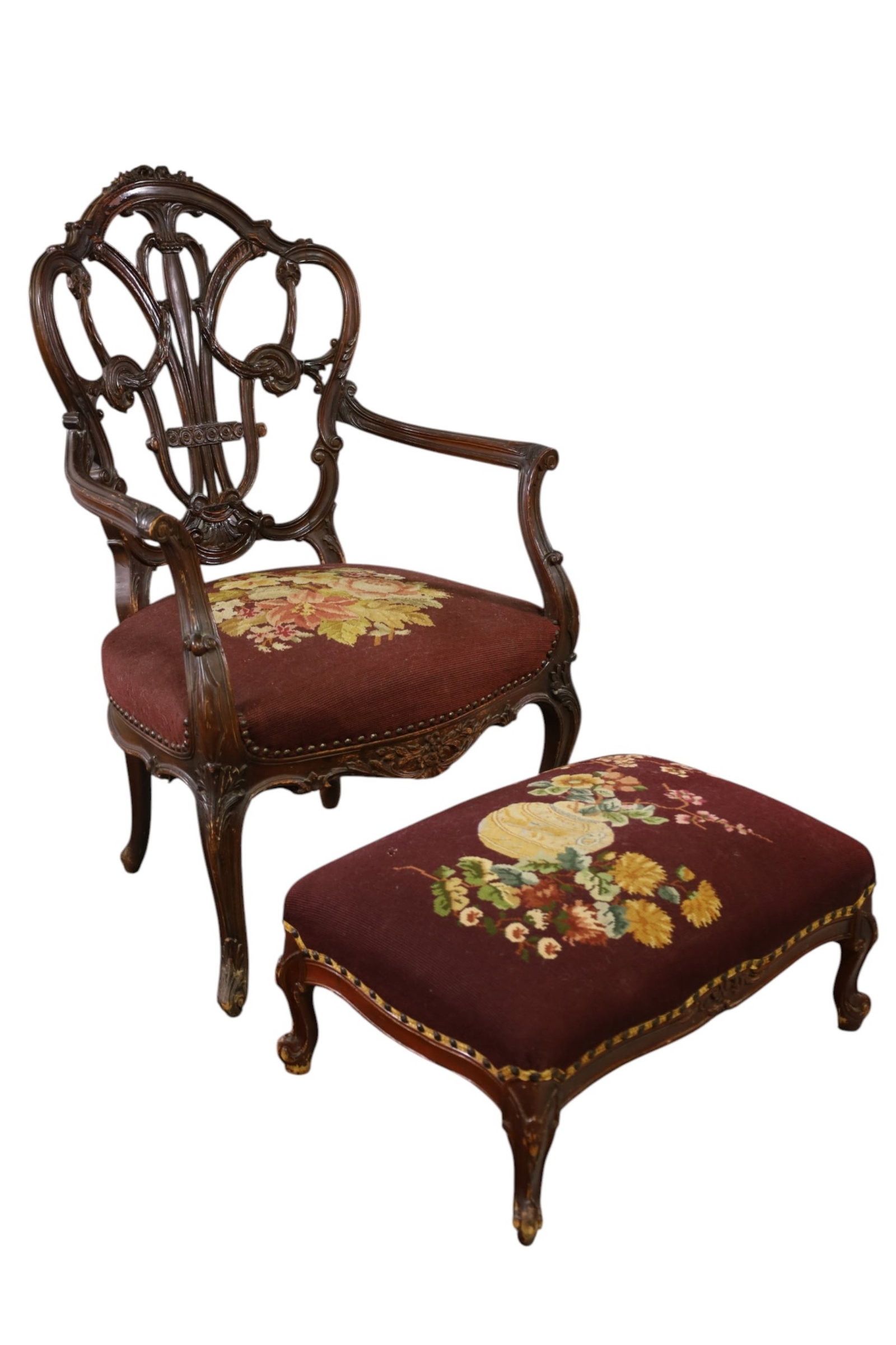 CARVED CHAIR & FOOTSTOOL: CARVED CHAIR AND FOOTSTOOL, BREAKS TO CHAIR, FINISH LOSS. 26" W x 26" D x 41" H. & 24" W x 17" D x 12" H. THIS ITEM EXCEEDS SIZE, WEIGHT, AND OR FRAGILITY LIMITATIONS FOR IN HOUSE SHIPPING, MUST BE