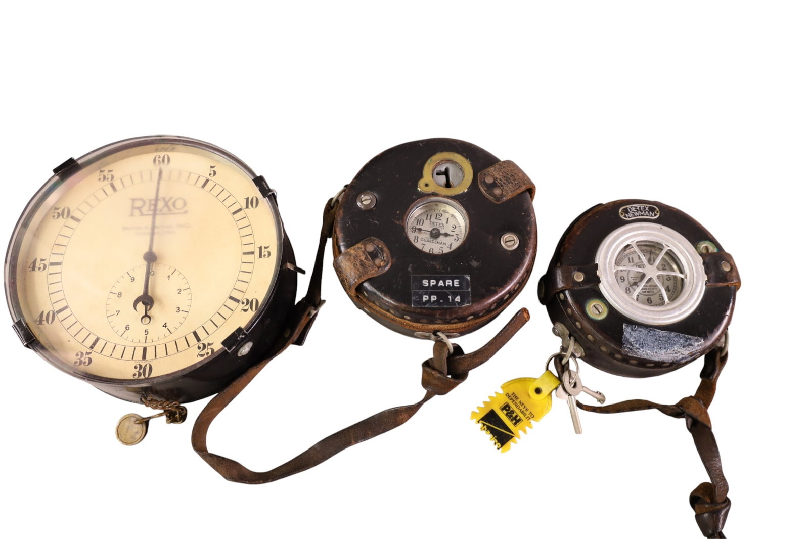 3 CLOCKS: 2 DETEX GUARDMAN'S CLOCKS, & REXO CLOCK. 5 1/2" - 8" DIAM . ALL CLOCKS ARE SOLD AS IS WE DO NOT GUARANTEE WORKING ORDER.