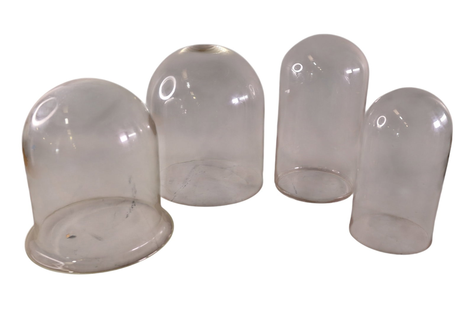 4 GLASS DOMES: 4 GLASS DOMES. 5 1/2" - 10" DIAM. THIS ITEM EXCEEDS SIZE, WEIGHT, AND OR FRAGILITY LIMITATIONS FOR IN HOUSE SHIPPING, MUST BE PICKED UP IN HOUSE OR SHIPPED VIA 3RD PARTY SHIPPER.